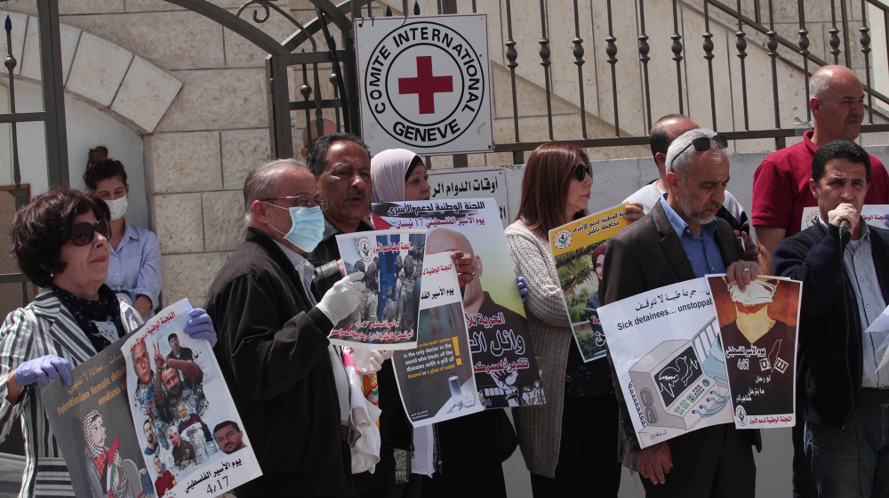 People gather to draw attention to circumstances Palestinian prisoners face in Israeli jails, in front of the headquarters of International Committee of the Red Cross in Nablus, West Bank on April 16,