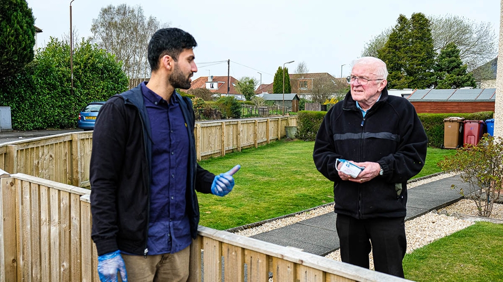 Jawad Javed delivers care packages to the elderly and vulnerable families on a daily basis. [Sobhan Sheikh/Al Jazeera]
