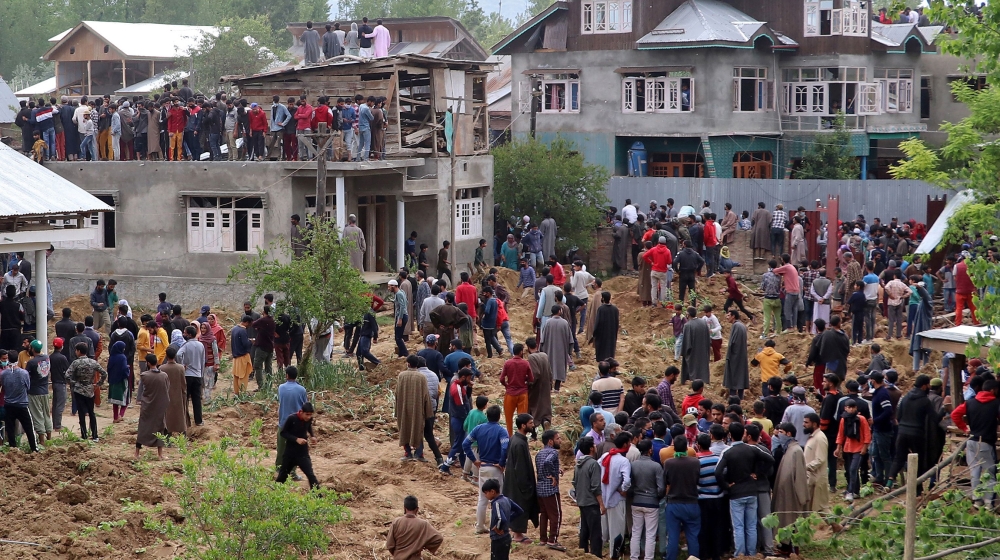 People gather after two militants including Hizbul Mujahideen commander Riyaz Naikoo were killed in a gun battle with Indian soldiers at Beighpora village in south Kashmir's Pulwama district May 6, 20