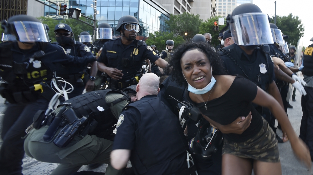 Atlanta Police detain demonstrators protesting, Saturday, May 30, 2020 in Atlanta. The protest started peacefully earlier in the day before demonstrators clashed with police. Demonstrators took to the