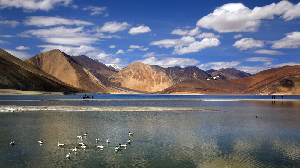 Indian tourist rides on a horse back at the Pangong lake high up in Ladahak region of India. The Chinese soldiers hurled stones while attempting to enter Ladakh region near Pangong Lake on Tuesday but
