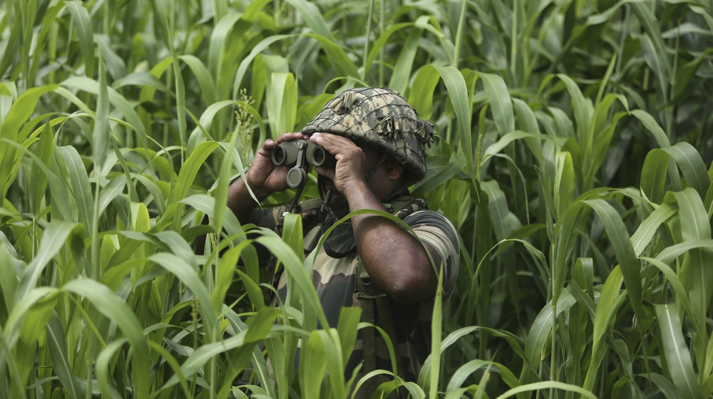 An Indian Border Security Force (BSF) soldier keeps vigil near the India Pakistan border at Garkhal in Akhnoor, about 35 kilometers (22 miles) west of Jammu, India, Tuesday, Aug.13, 2019. Pakistan has