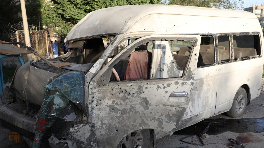 A wreckage of a bus which carried employees of an Afghan television station and was bombed is seen in Kabul