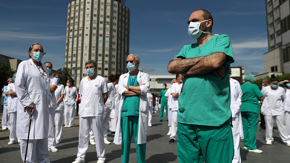Staff from La Paz hospital take a minute of silence to remember Joaquin Diaz, the hospital''s chief of surgery who died of COVID-19, amid the coronavirus disease (COVID-19) outbreak in Madrid, Spain, A