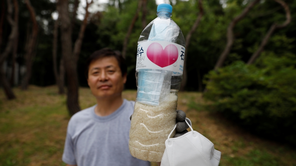 North Korean defector group prepares plastic bottles filled with rice and masks to be sent towards North Korea