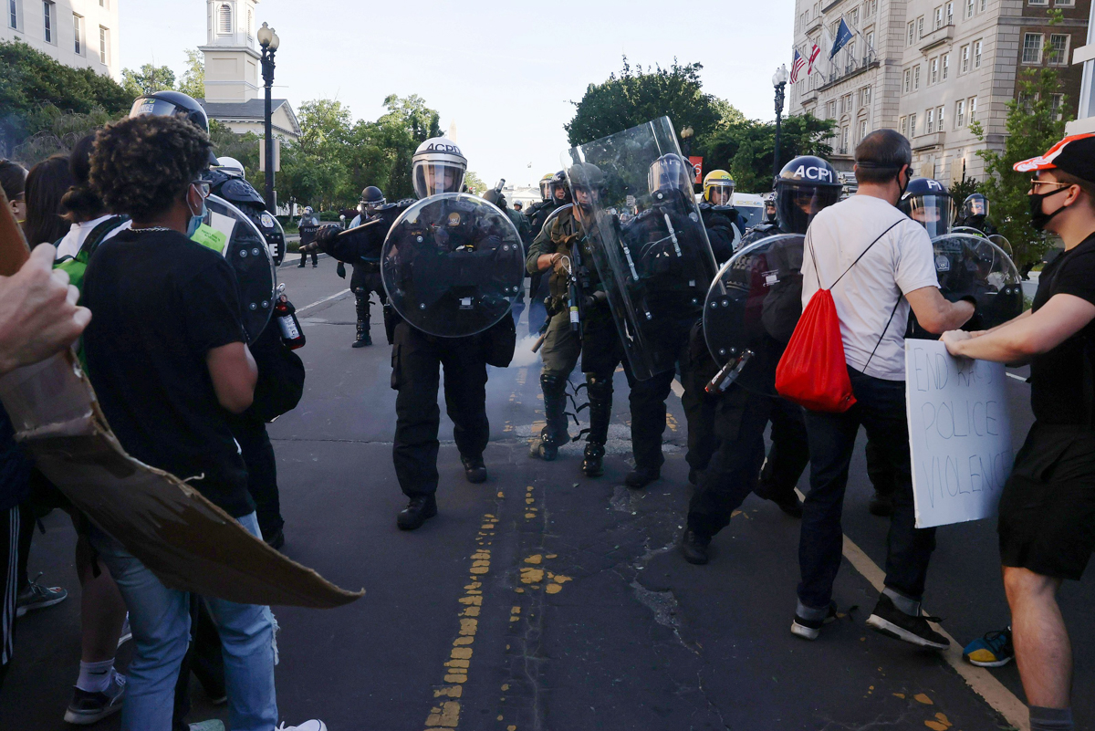 Police move in to eject protesters from the vicinity of St. John’s Church before U.S. President Donald Trump paid a visit, during demonstrations against the death in Minneapolis police custody of Geor