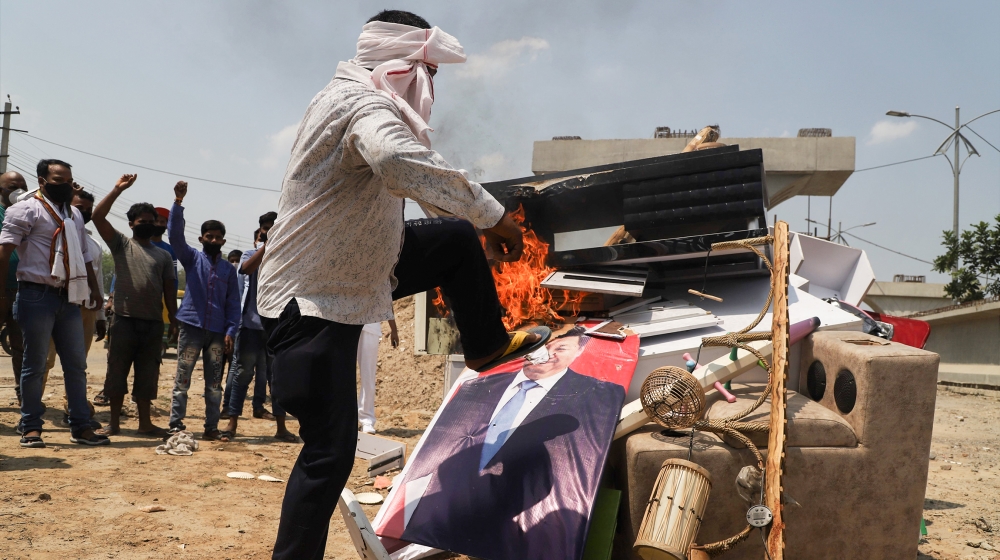 Indians Protesters hold placards and shout slogans during a protest against Chinese President Xi Jinping in Gurugram on the outskirts of New Delhi, India on 17 June 2020. Seventeen Indian Army soldier