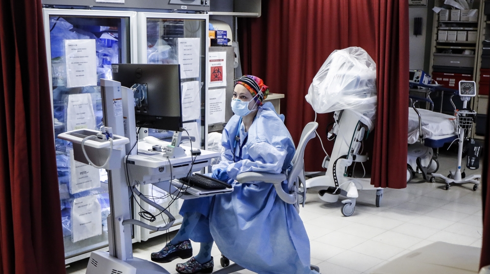 Medical personnel wearing personal protective equipment work in the emergency department at NYC Health + Hospitals Metropolitan, Wednesday, May 27, 2020, in New York. At hospitals around the country,