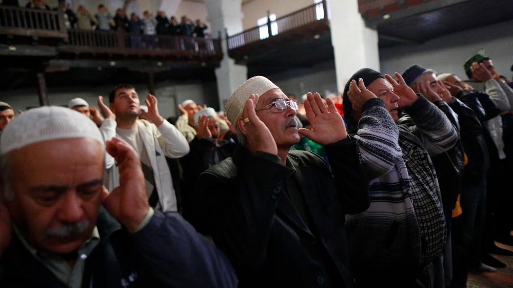 Crimean Tatar Muslims pray in the Great Khan Mosque on the first day of the Eid al-Adha in the city of Bakhchisaray in October 2014