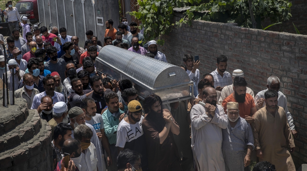 Relatives and neighbors carry the coffin of civilian Bashir Ahmed Khan during his funeral on the outskirts of Srinagar, Indian controlled Kashmir, Wednesday, July 1, 2020. Suspected rebels attacked pa
