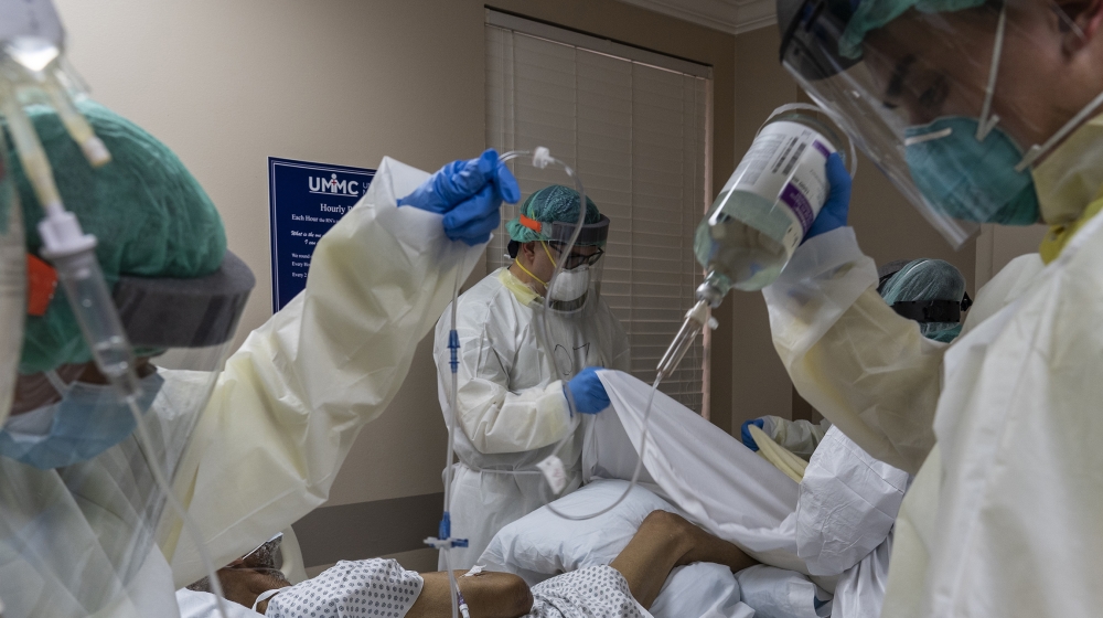 HOUSTON, TX - JULY 2: (EDITORIAL USE ONLY) Members of the medical staff treat a patient in the COVID-19 intensive care unit at the United Memorial Medical Center on July 2, 2020 in Houston, Texas. COV