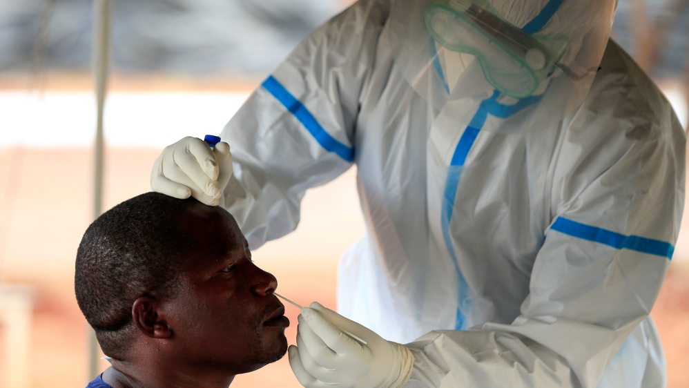 A man is tested by a healthcare worker during a nationwide lockdown to help curb the spread of the coronavirus disease (COVID-19), at a mass screening centre, in Harare