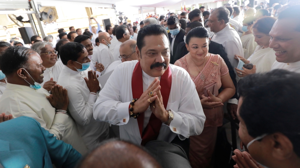 Sri Lanka''s Prime Minister Mahinda Rajapaksa gestures as he leaves after his swearing in ceremony as the new Prime Minister, at Kelaniya Buddhist temple in Colombo