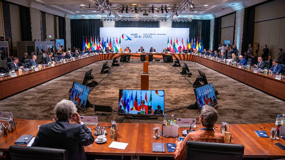 German Defence Minister Annegret Kramp-Karrenbauer (background, C-L) and NATO Secretary General Jens Stoltenberg (background, C) attend an informal meeting of EU defence ministers on August 26, 2020