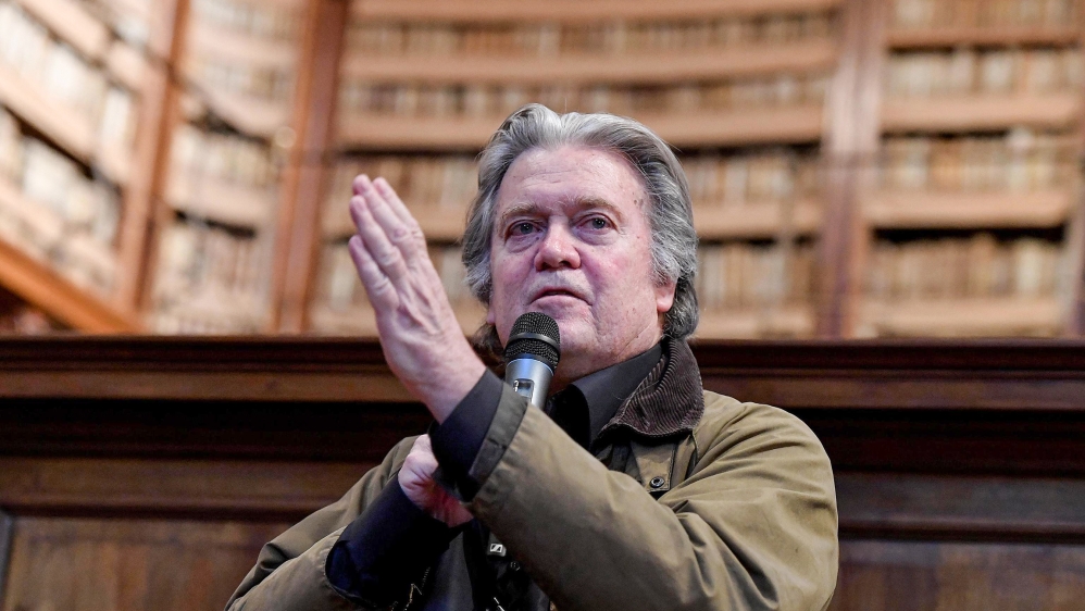 Former White House strategist Steve Bannon speaks as he holds The Daily Telegraph newspaper during a political meeting in Rome, Italy, 21 March 2019. EPA-EFE/ETTORE FERRARI