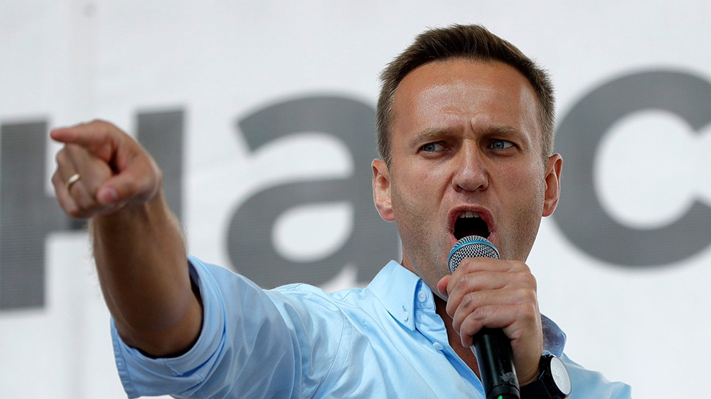 In this file photo taken on Saturday, July 20, 2019, Russian opposition activist Alexei Navalny gestures while speaking to a crowd during a political protest in Moscow, Russia. Russian doctors treatin
