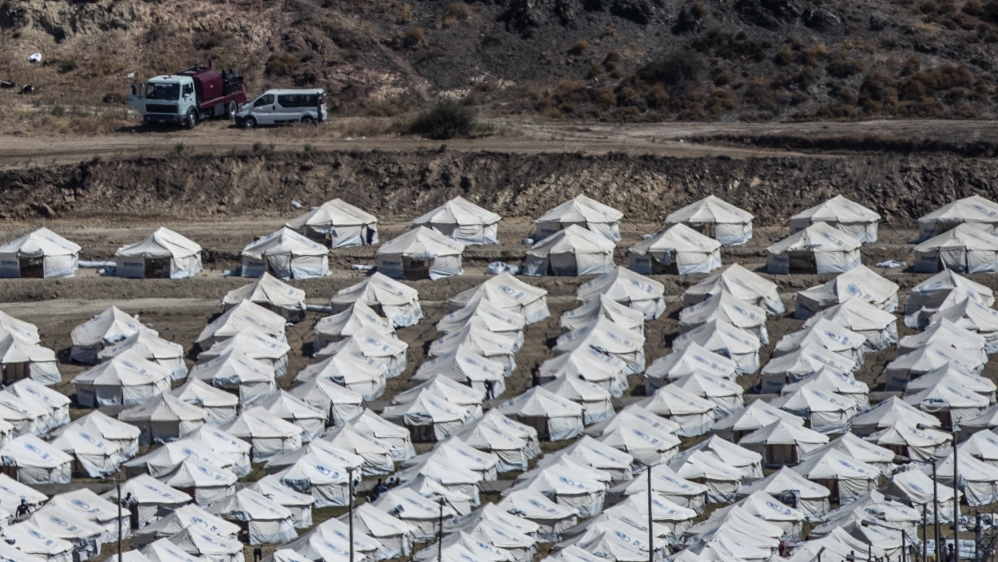 A general view of the temporary camp for refugees and migrants near Mytilene town, on the northeastern island of Lesbos, Greece, Sunday Sept. 13, 2020. Greek authorities have been scrambling to find a