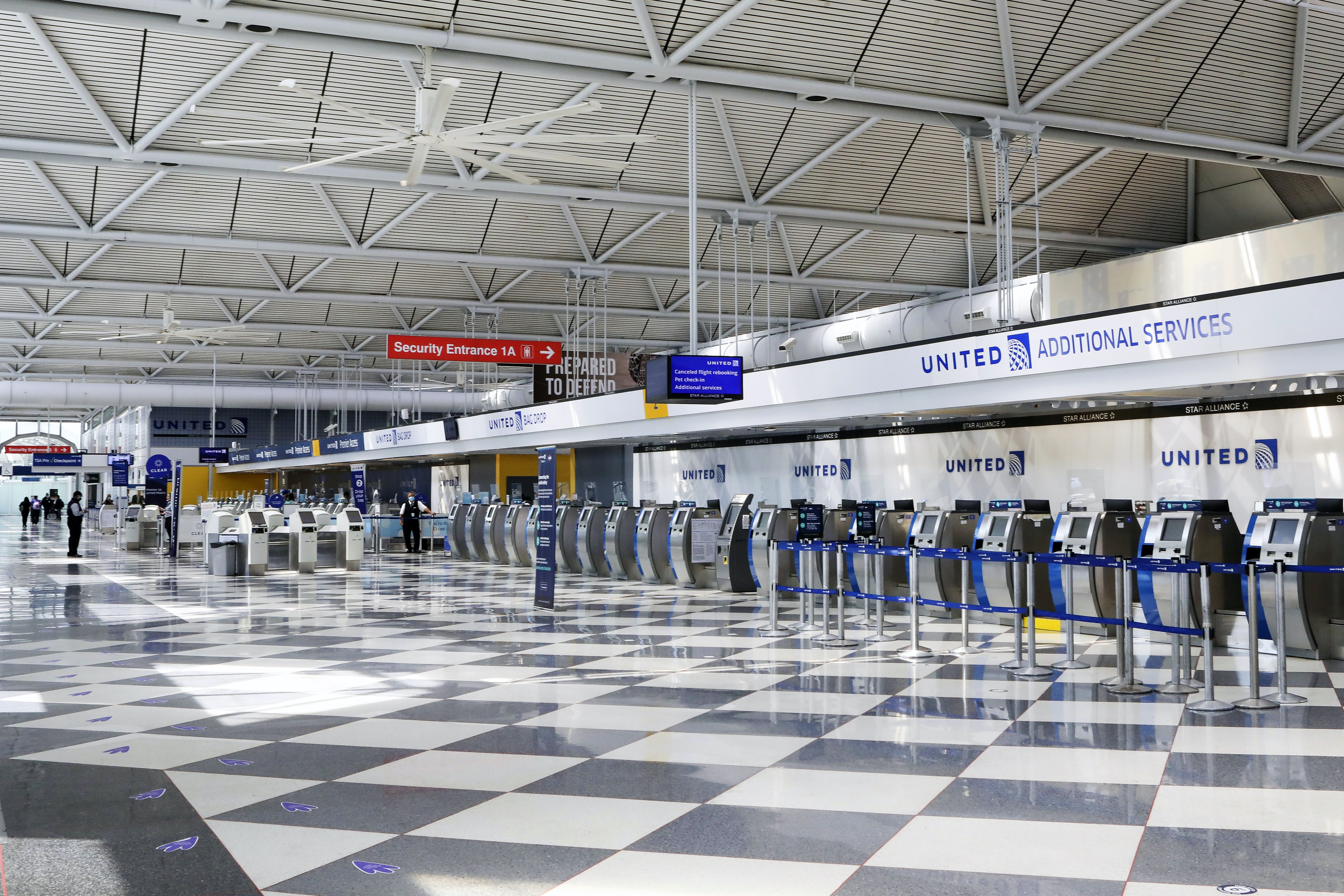 Rows of United Airlines check-in counters at O'Hare International Airport in Chicago are seen unoccupied on June 25, 2020, amid the coronavirus pandemic [AP/Teresa Crawford]