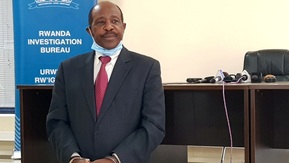 FILE PHOTO: Rusesabagina is detained and paraded in front of media in handcuffs in Kigali