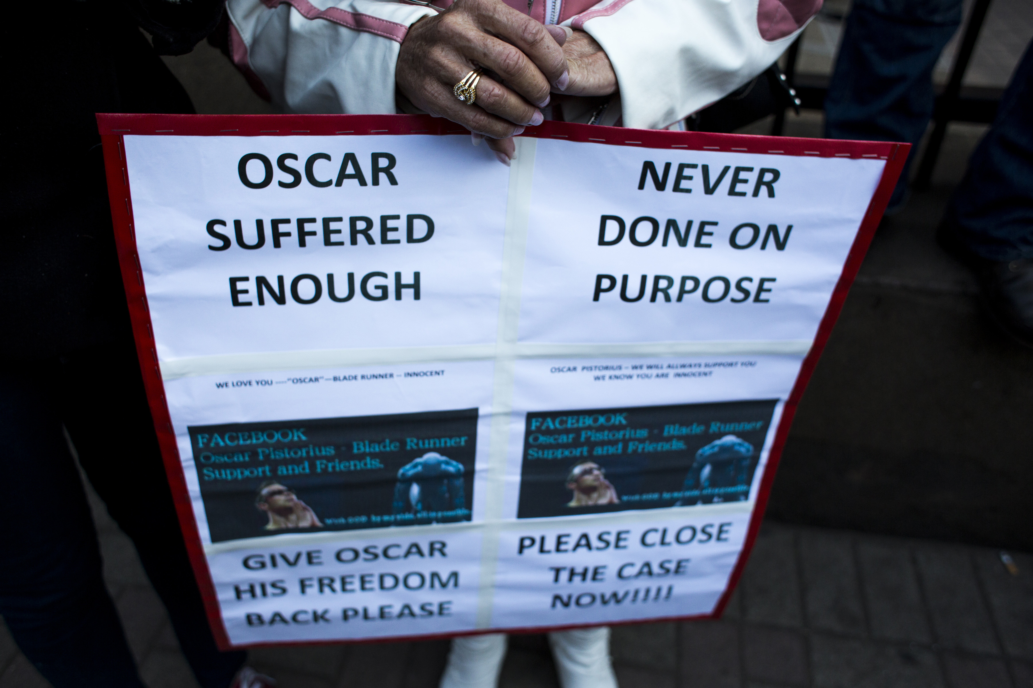 A supporter of Oscar Pistorius stands outside the North Gauteng High Court on July 6, 2016 in Pretoria, South Africa. Pistorius was convicted of killing his girlfriend Reeva Steenkamp at their home in 2013 [Charlie Shoemaker/Getty Images]