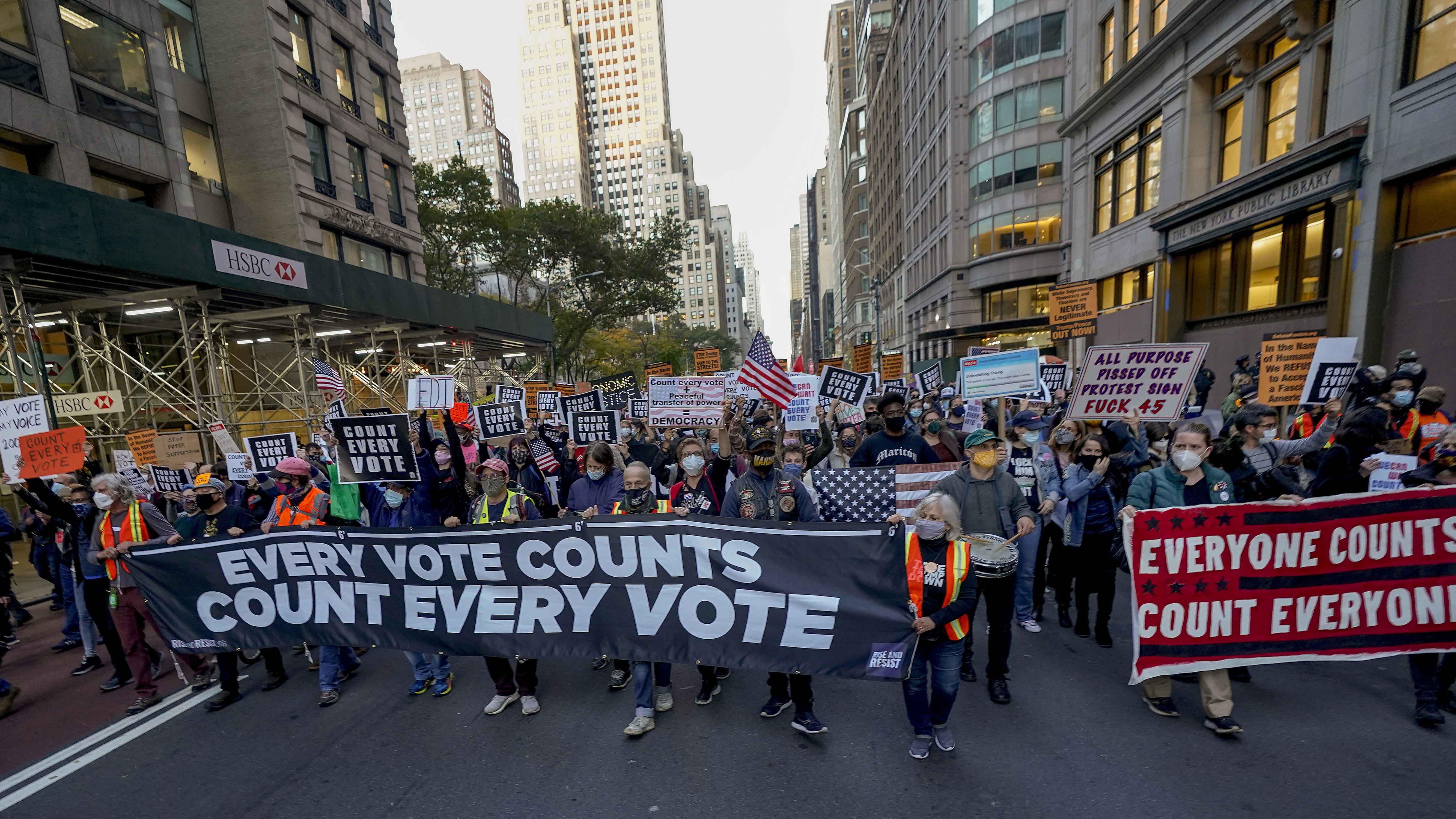 Demonstrators march down Fifth Avenue to advocate for the counting of all votes on November 4, 2020, in New York [AP/Frank Franklin II]