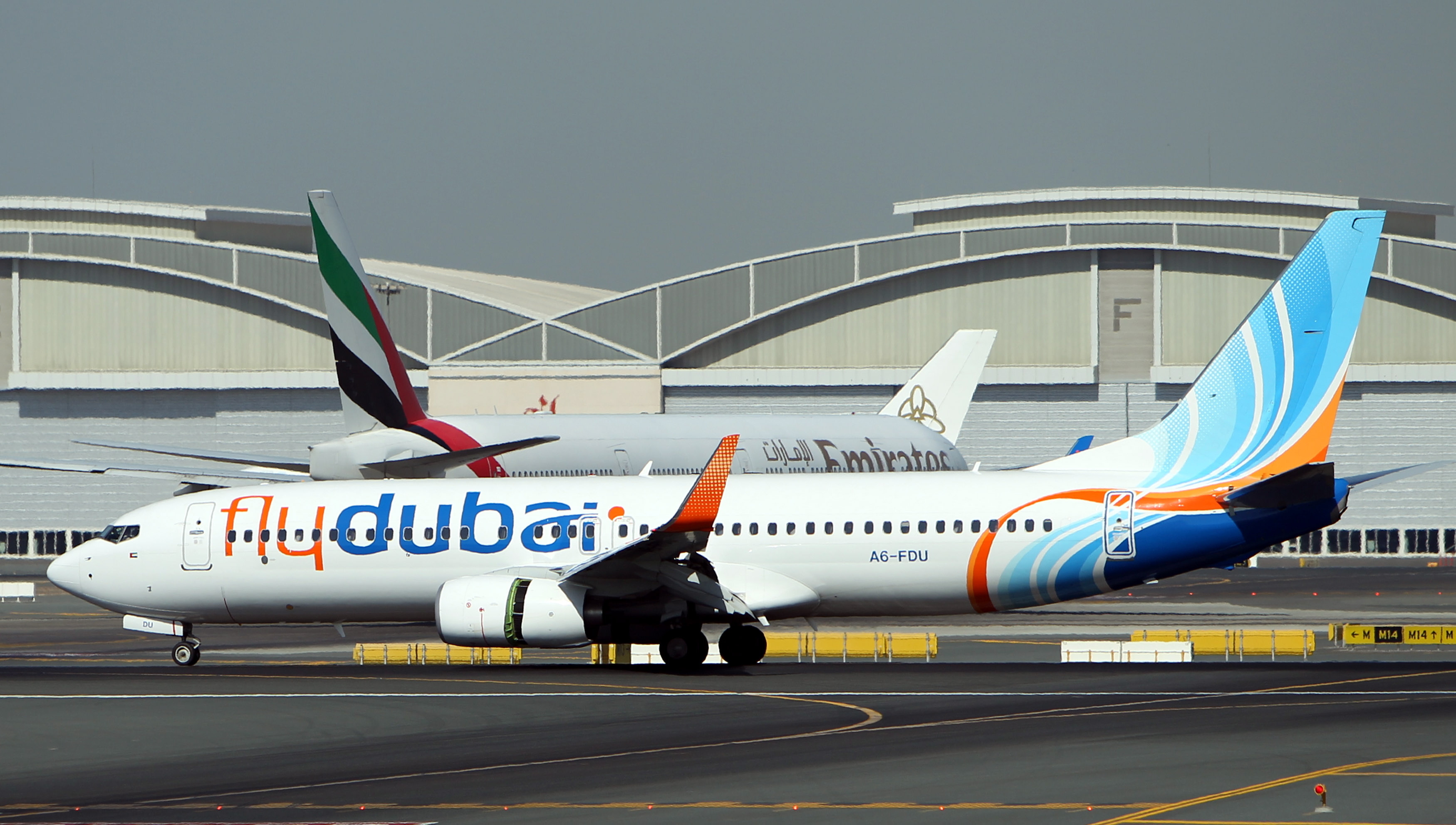 An aircraft (front) owned by 'Fly Dubai'