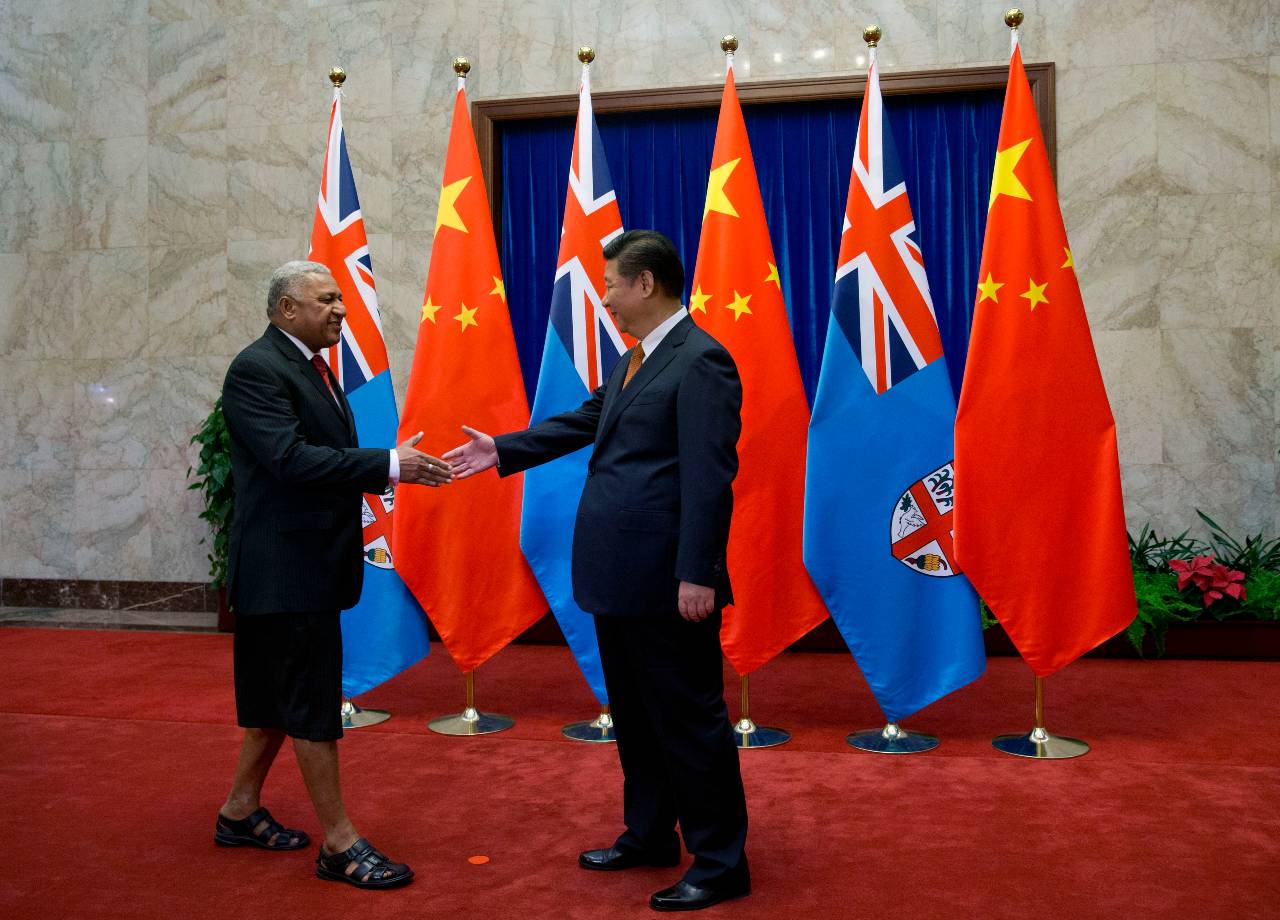 Chinese President Xi Jinping welcomes Fiji's Prime Minister Frank Bainimarama during a visit to Beijing [File: Andy Wong/EPA]