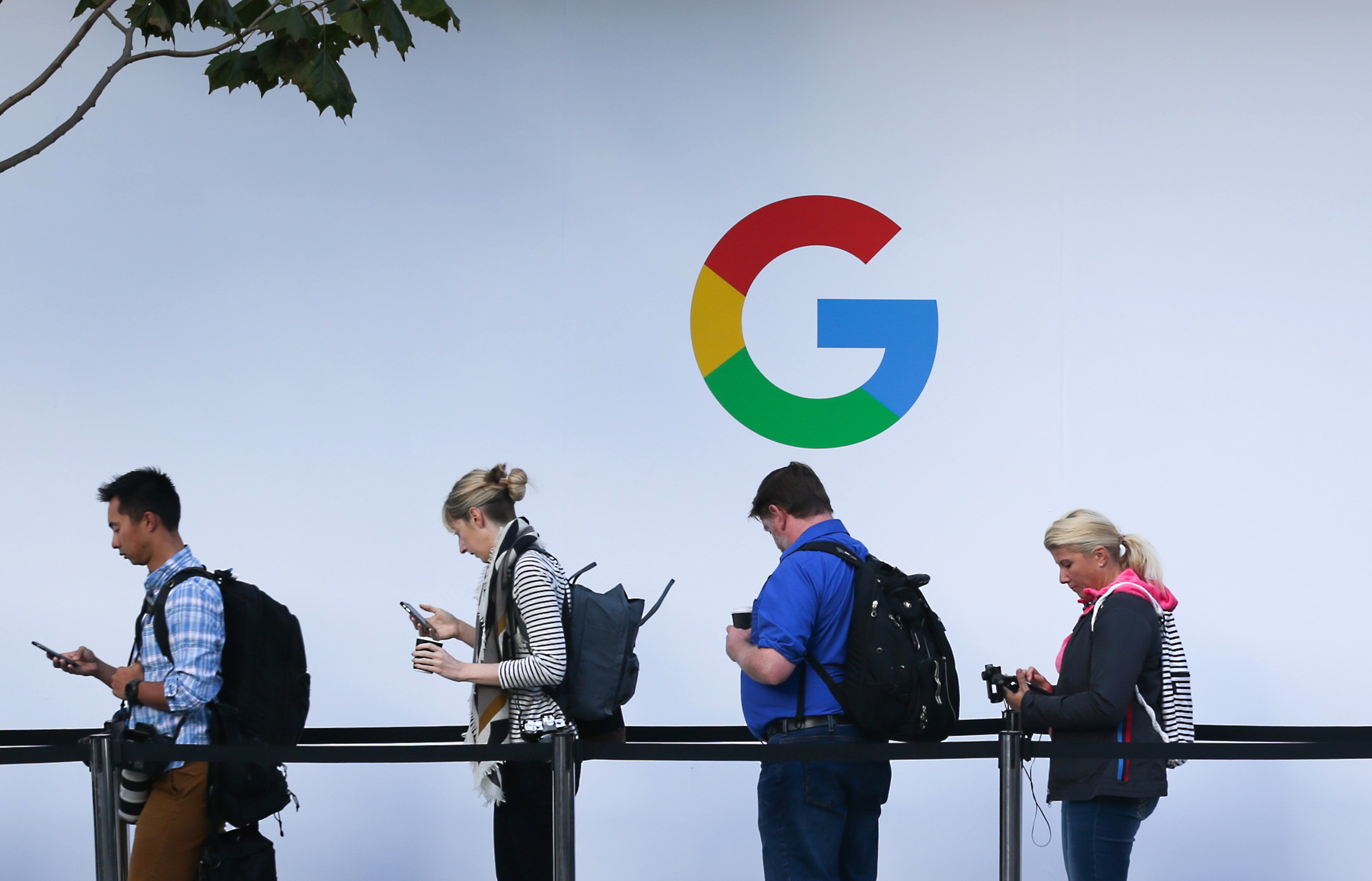 People wait in line to enter a Google product launch event in San Francisco, California