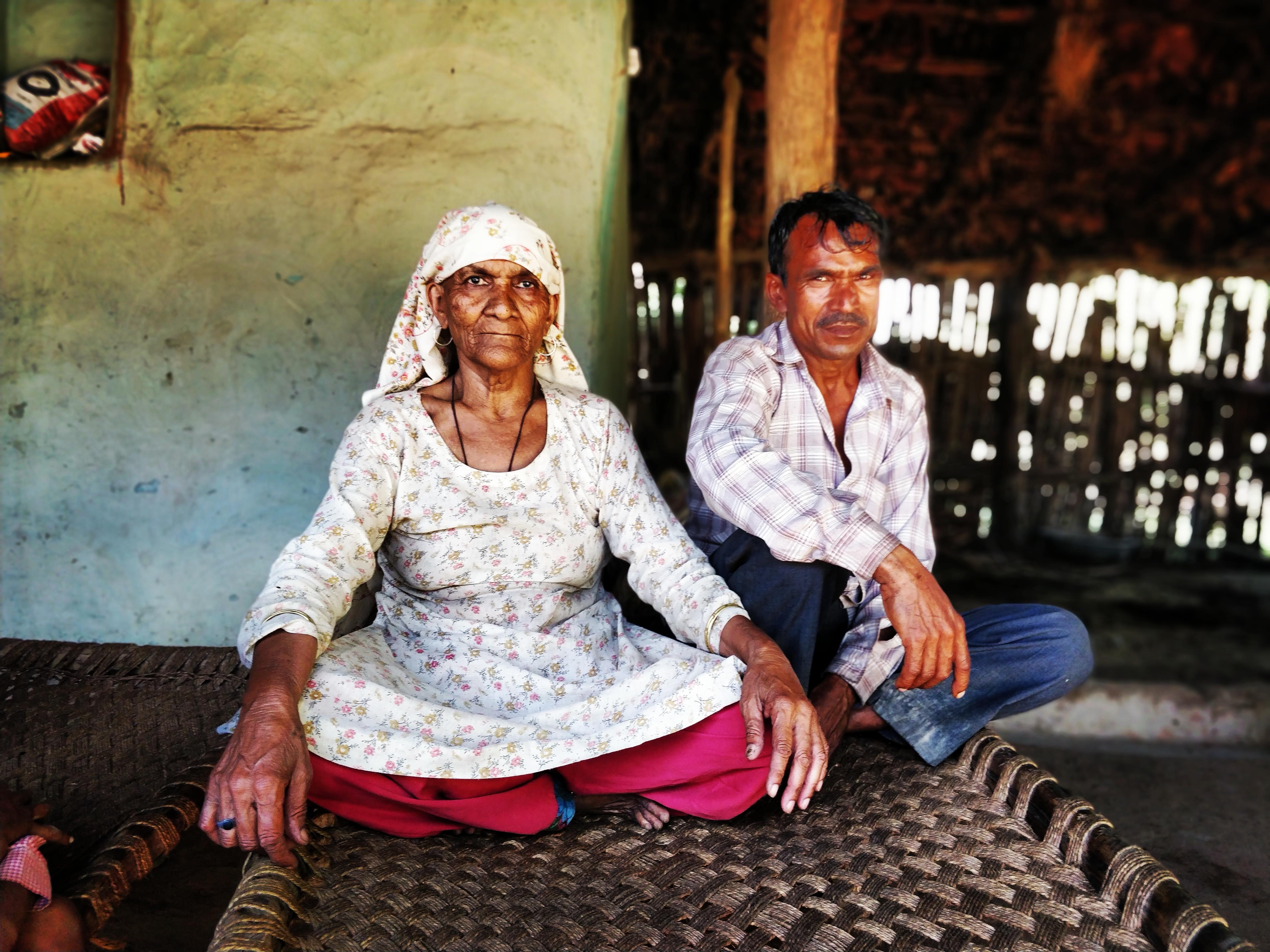 Bidawadi, a Tongia woman, and her nephew Jaswant. Bidawadi has spent half her life working in the forest and has many tales to narrate of animal-human conflict that she has witnessed in her village, Sodhinagar [Devyani Nighoskar/Al Jazeera]