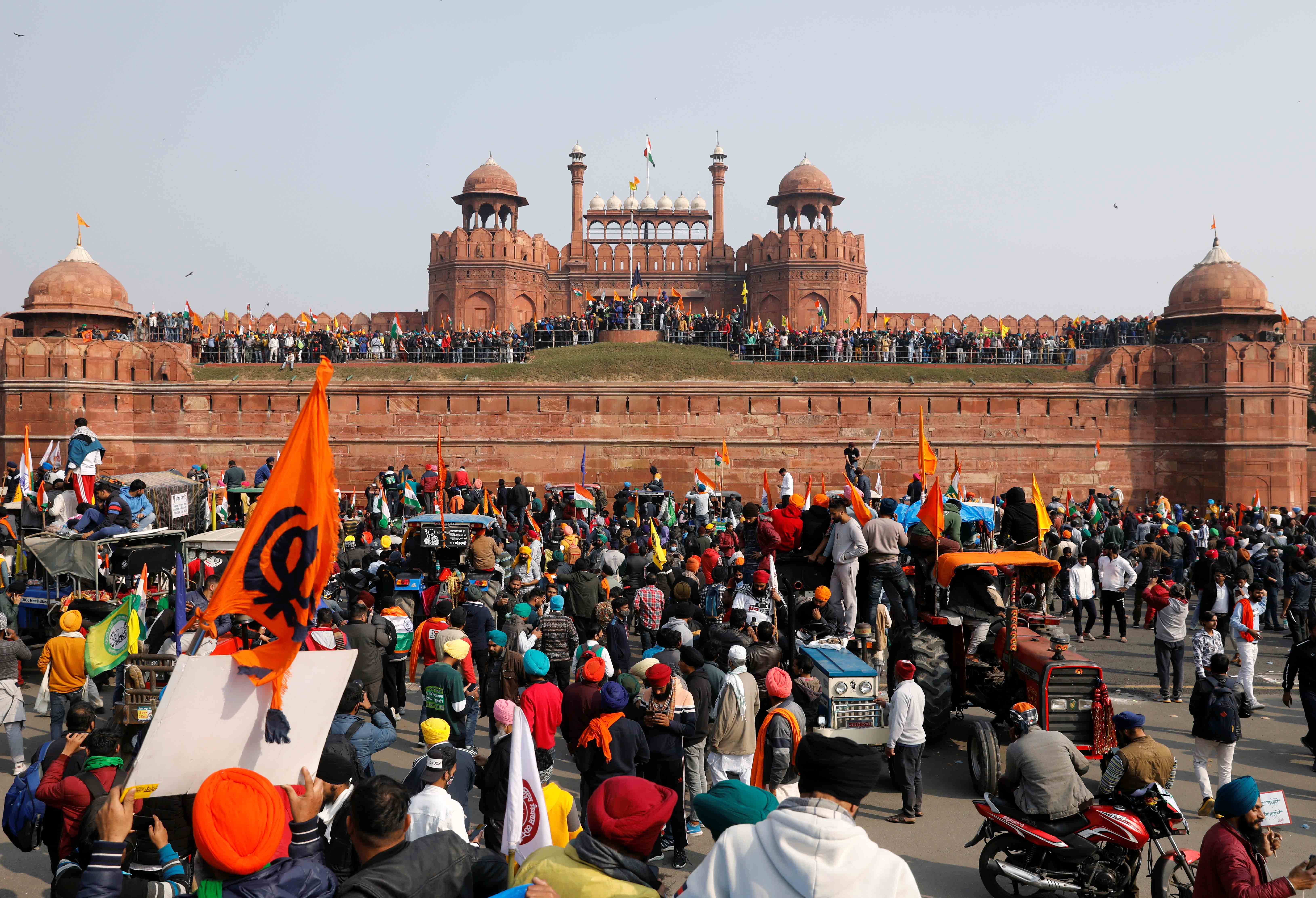 Farmers participate in a protest against farm laws introduced by the government, at the historic Red Fort in Delhi on January 26, 2021 [Reuters/Adnan Abidi]