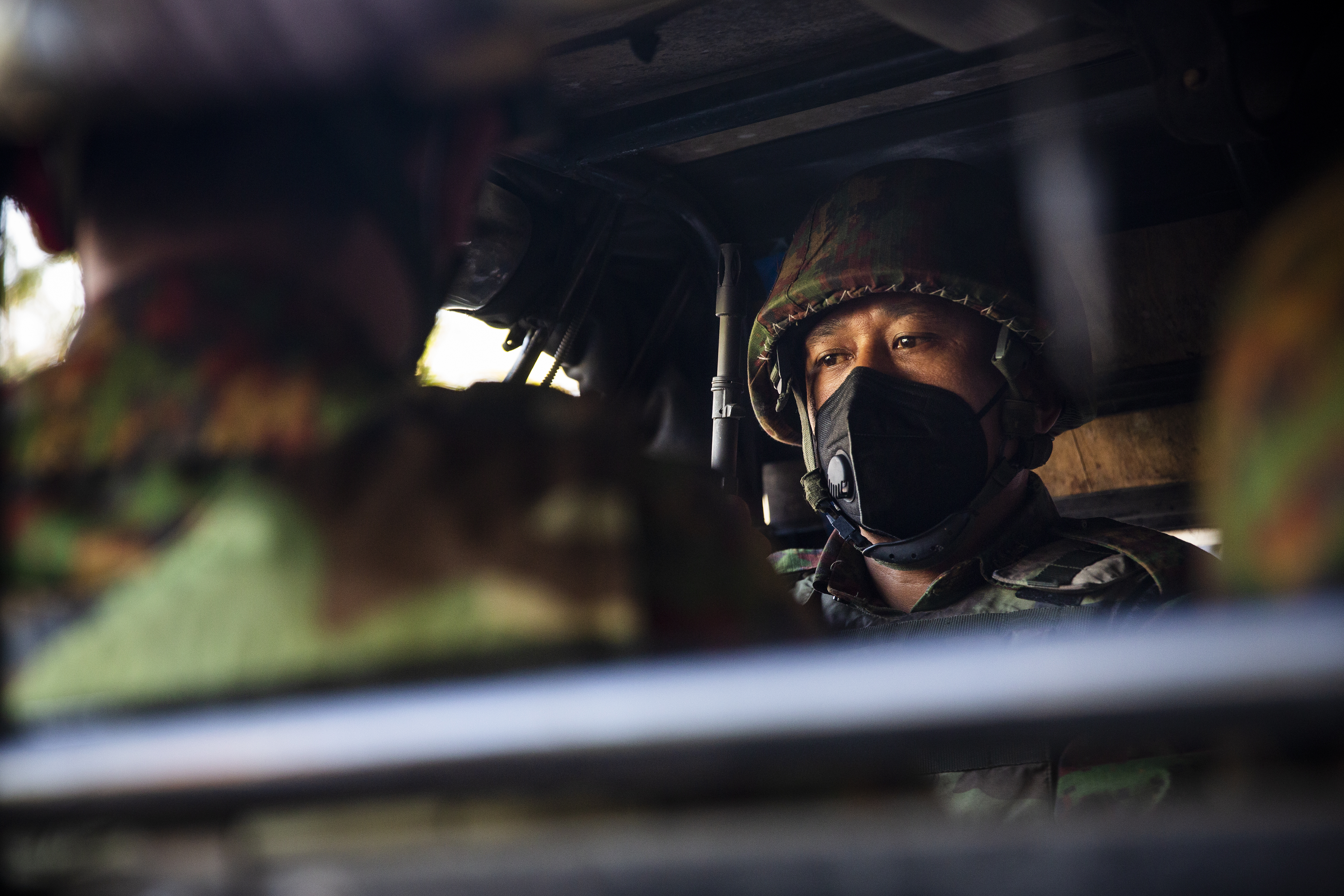 Armed military soldiers in a car in downtown Yangon. Myanmar's military seized power and and said it will rule the country for at least one year after detaining its top political leaders [File: Stringer/Anadolu Agency]