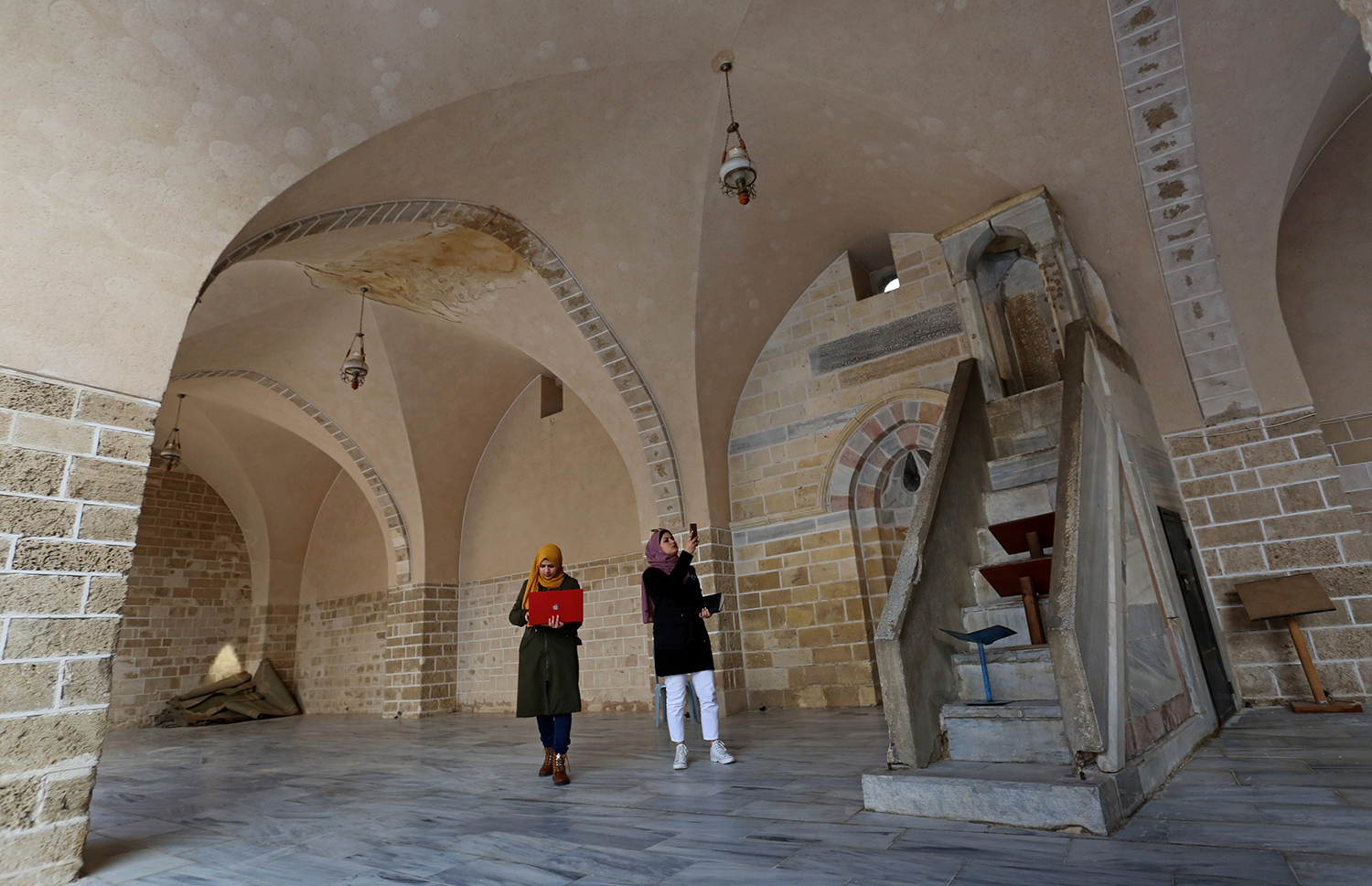 Nisma al-Sallaq and Mayar Humaid started their project to archive Gaza's historical sites and buildings in 2014 [Ashraf Amra/Al Jazeera]