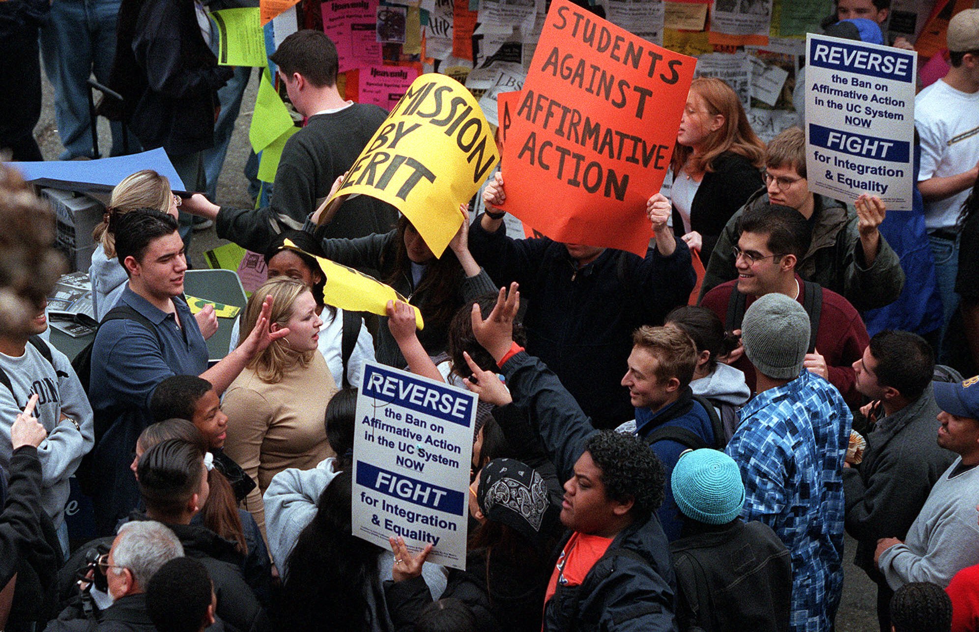 In a photo from 2001, students against affirmative action, right, are confronted by another group for affirmative action during the Day of Action to Reverse the Ban on Affirmative Action rally at the University of California-Berkeley [File: AP photo/Jakub Mosur]
