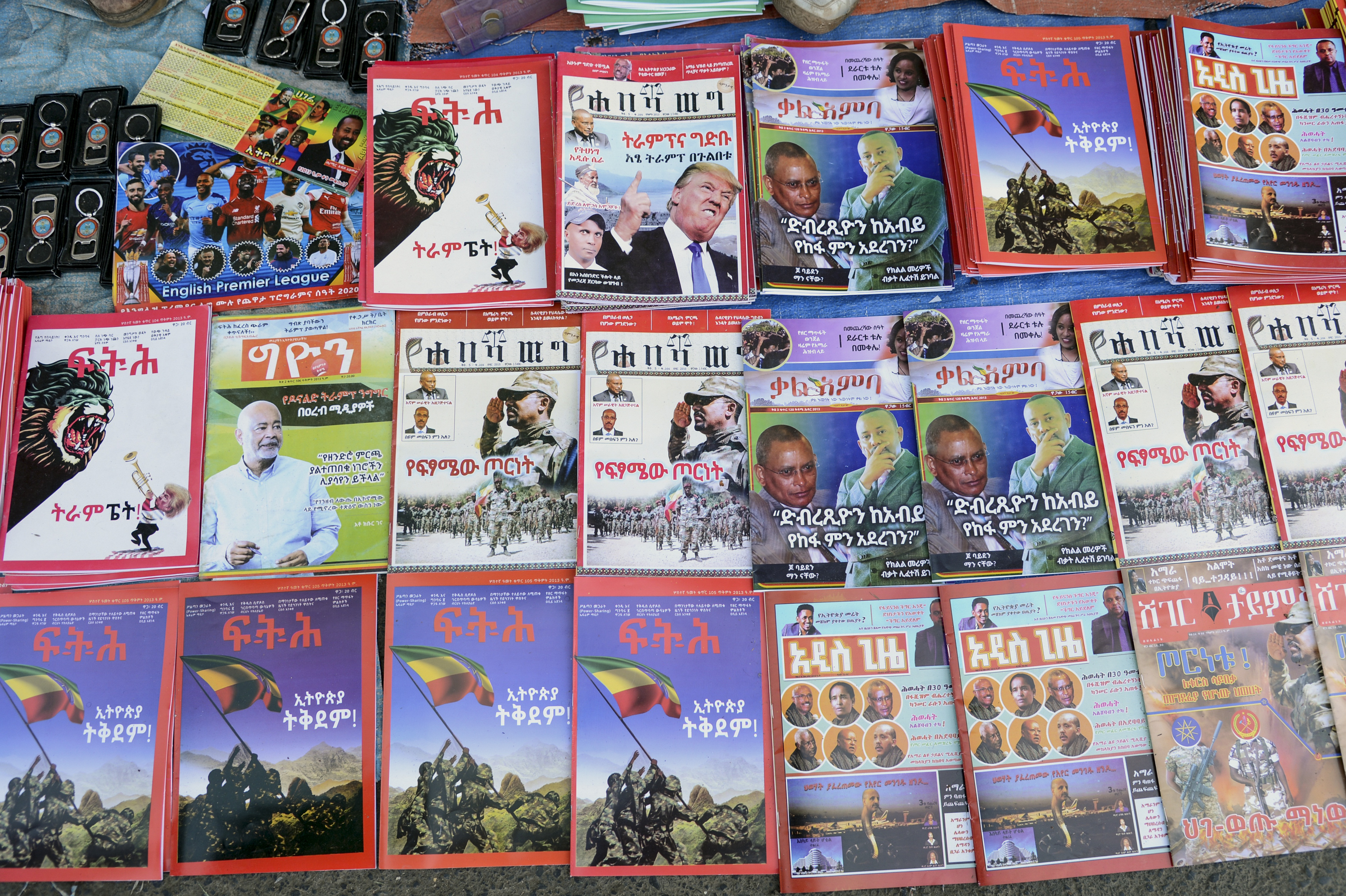 Newspapers and magazines reporting on Ethiopia's Tigray conflict seen at a news stand in Addis Ababa on November 7, 2020 [File: Samuel Habtab/AP Photo]