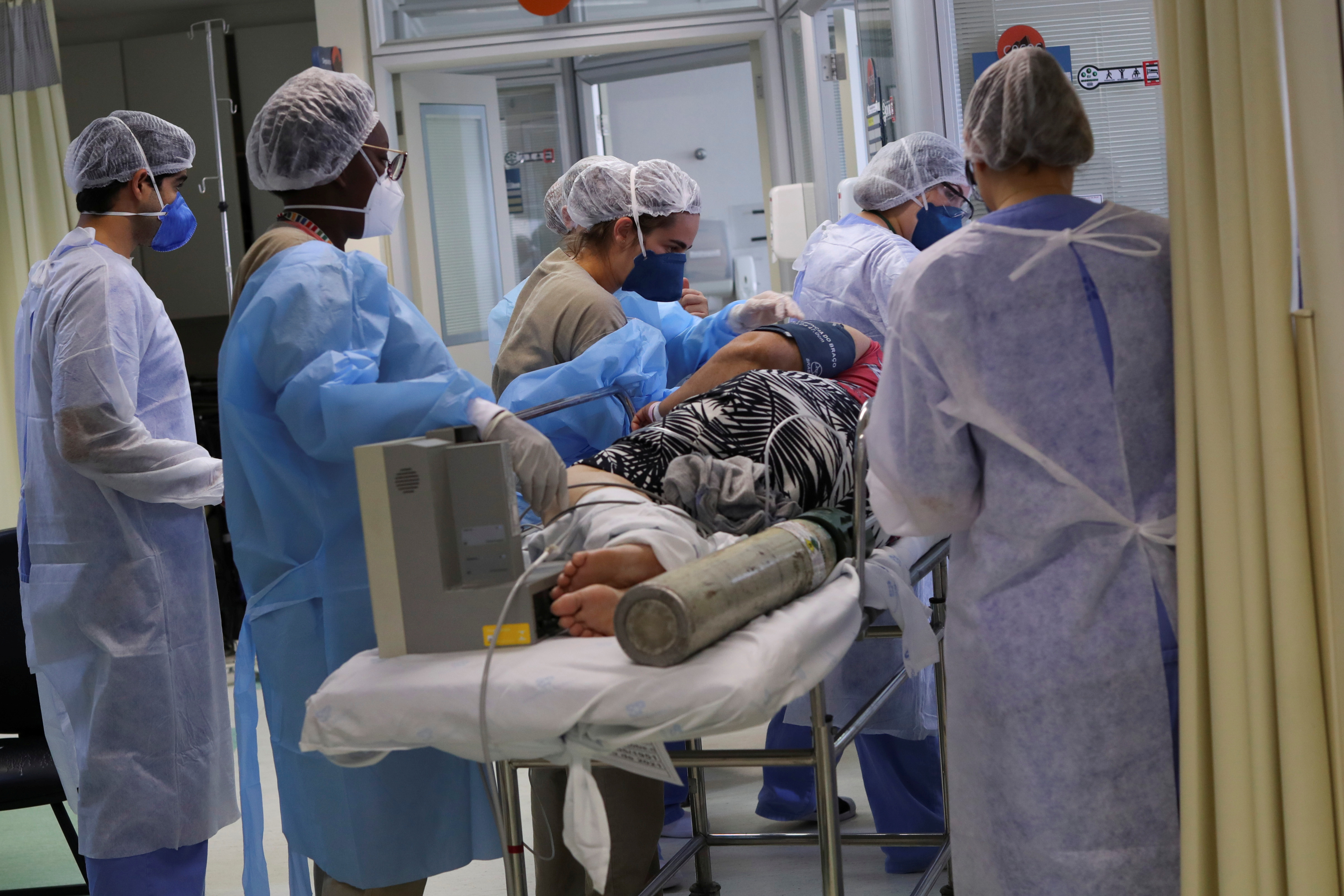 A COVID-19 patient is transferred to the intensive care unit of Hospital Sao Paulo in Sao Paulo, Brazil, March 17, 2021 [File: Amanda Perobelli/Reuters]