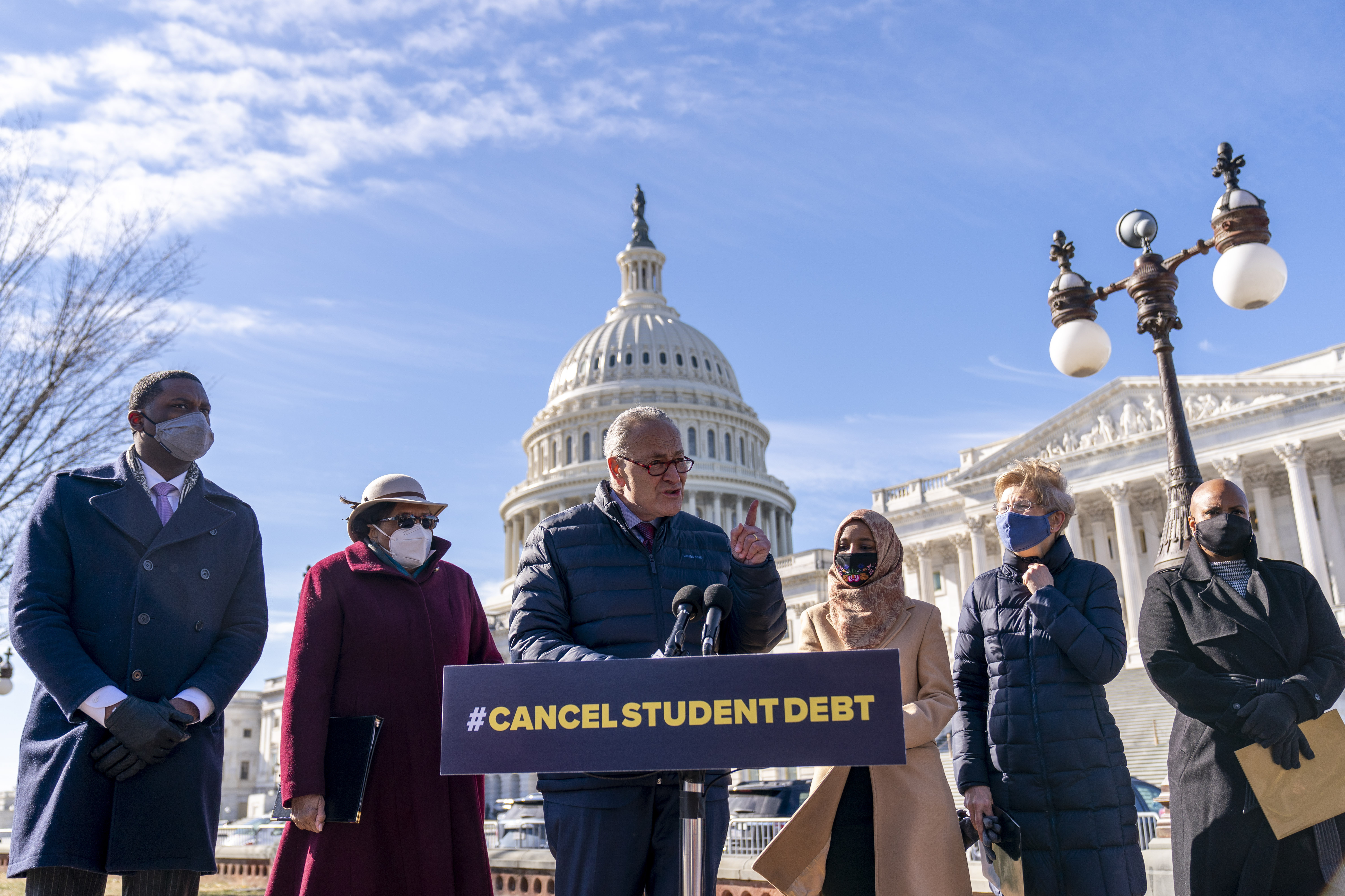 Senate Majority Leader Sen. Chuck Schumer of N.Y., centre, speaks at a news conference on Capitol Hill in Washington, Thursday, February 4, 2021, about plans to reintroduce a resolution to call on President Joe Biden to take executive action to cancel up to $50,000 in debt for federal student loan borrowers. (AP Photo/Andrew Harnik) (AP Photo)