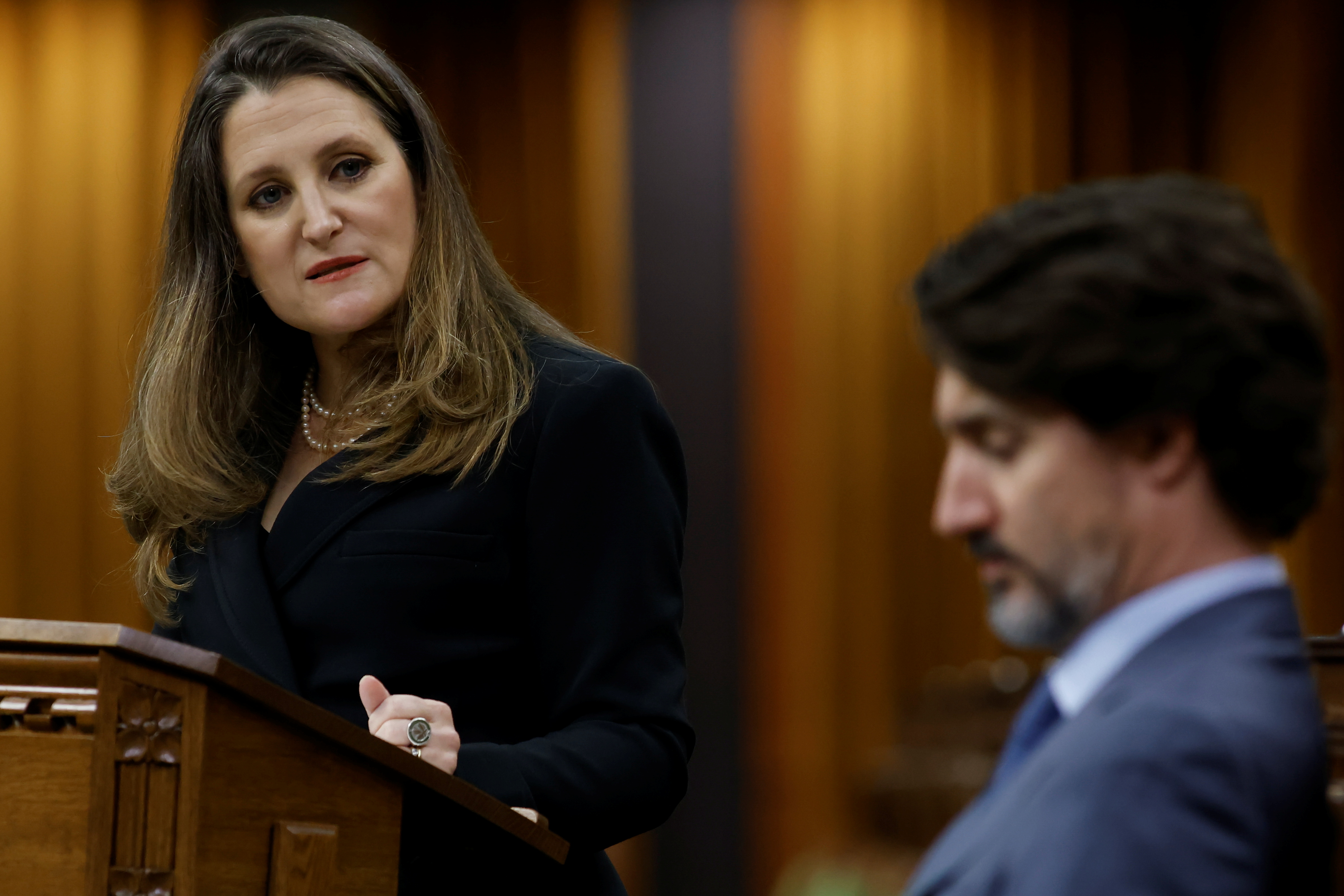 Canada's Finance Minister Chrystia Freeland looks at Prime Minister Justin Trudeau