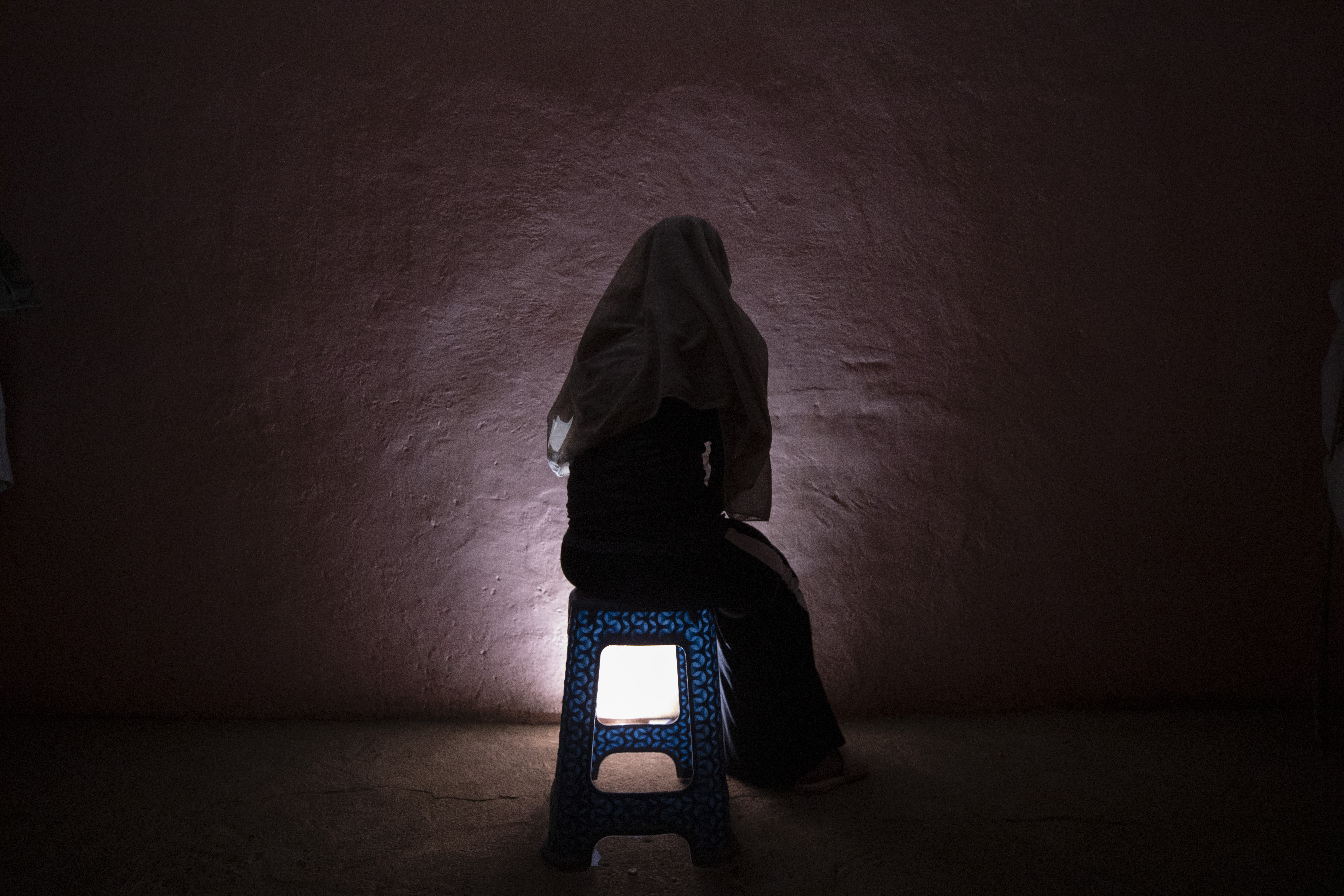 A Tigrayan refugee rape victim who fled the conflict in Ethiopia's Tigray sits for a portrait in eastern Sudan near the Sudan-Ethiopia border, on March 20, 2021. [AP Photo/Nariman El-Mofty]