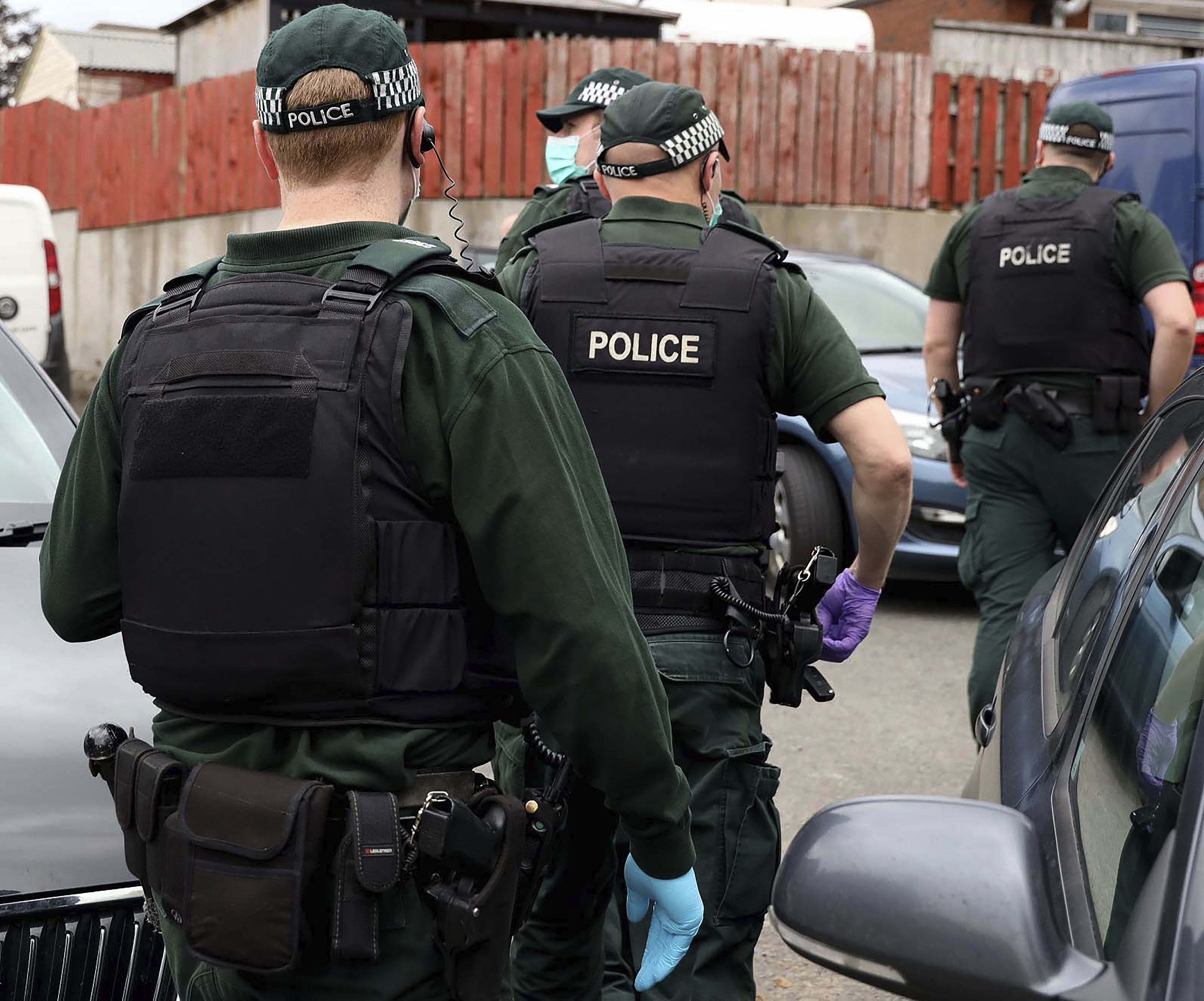 Police raid an undisclosed location in the UK as part of Operation Venetic, a series of raids and house arrests carried out last year after authorities hacked the messaging app Encrochat [File: Handout/Police Service of Northern Ireland via AP Photo]