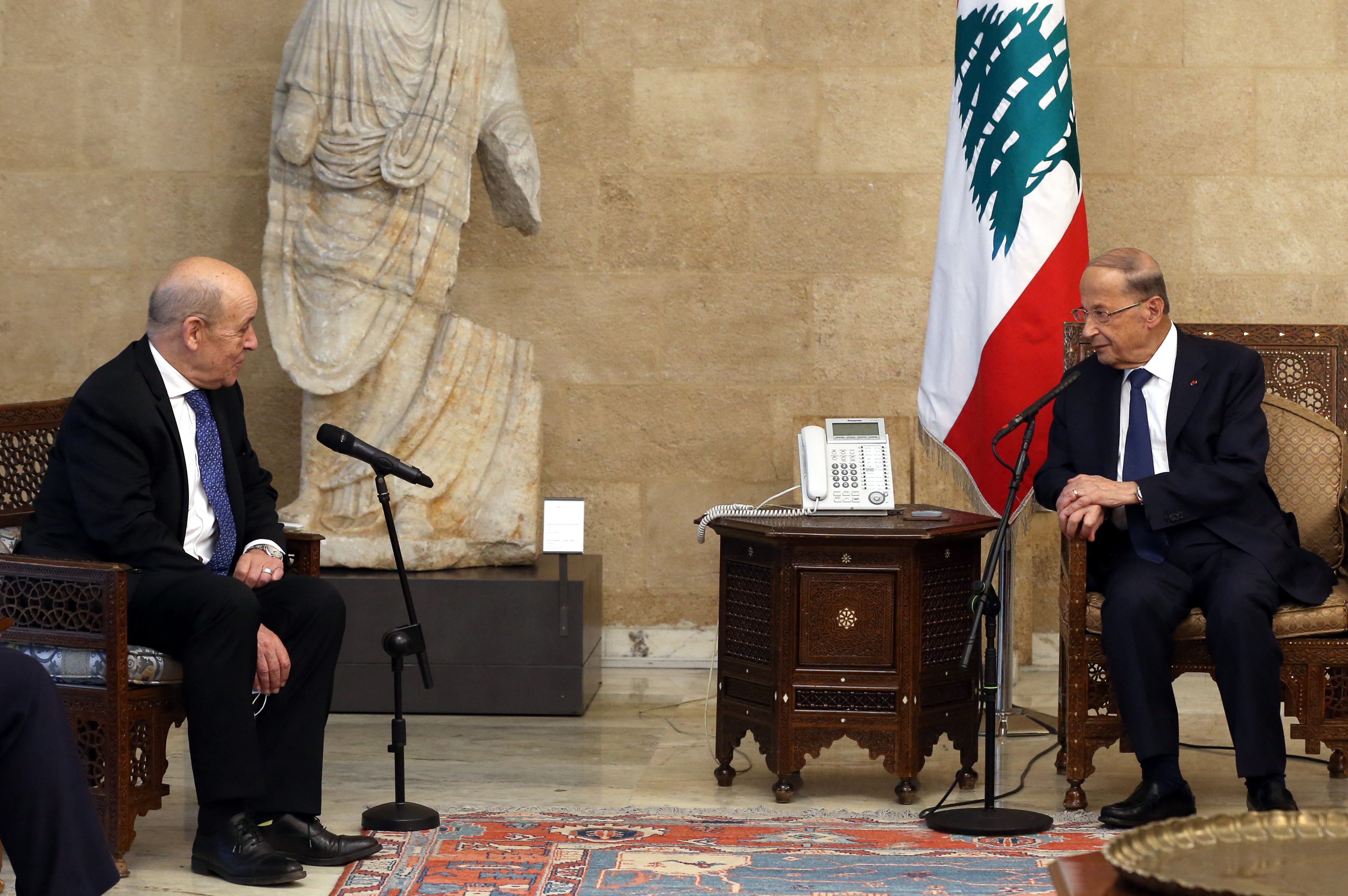 A handout picture provided by the Lebanese photo agency Dalati and Nohra shows Lebanon's President Michel Aoun (R) receiving French Foreign Minister Jean-Yves Le Drian at the presidential palace in Baabda, east of the capital Beirut on May 6, 2021. - Le Drian is in Lebanon for a two-day visit to meet with Lebanese officials and political and leaders about the continuing political and economic crisis. (Photo by JOSEPH EID / DALATI AND NOHRA / AFP) / === RESTRICTED TO EDITORIAL USE - MANDATORY CREDIT "AFP PHOTO / HO / DALATI AND NOHRA" - NO MARKETING - NO ADVERTISING CAMPAIGNS - DISTRIBUTED AS A SERVICE TO CLIENTS ===