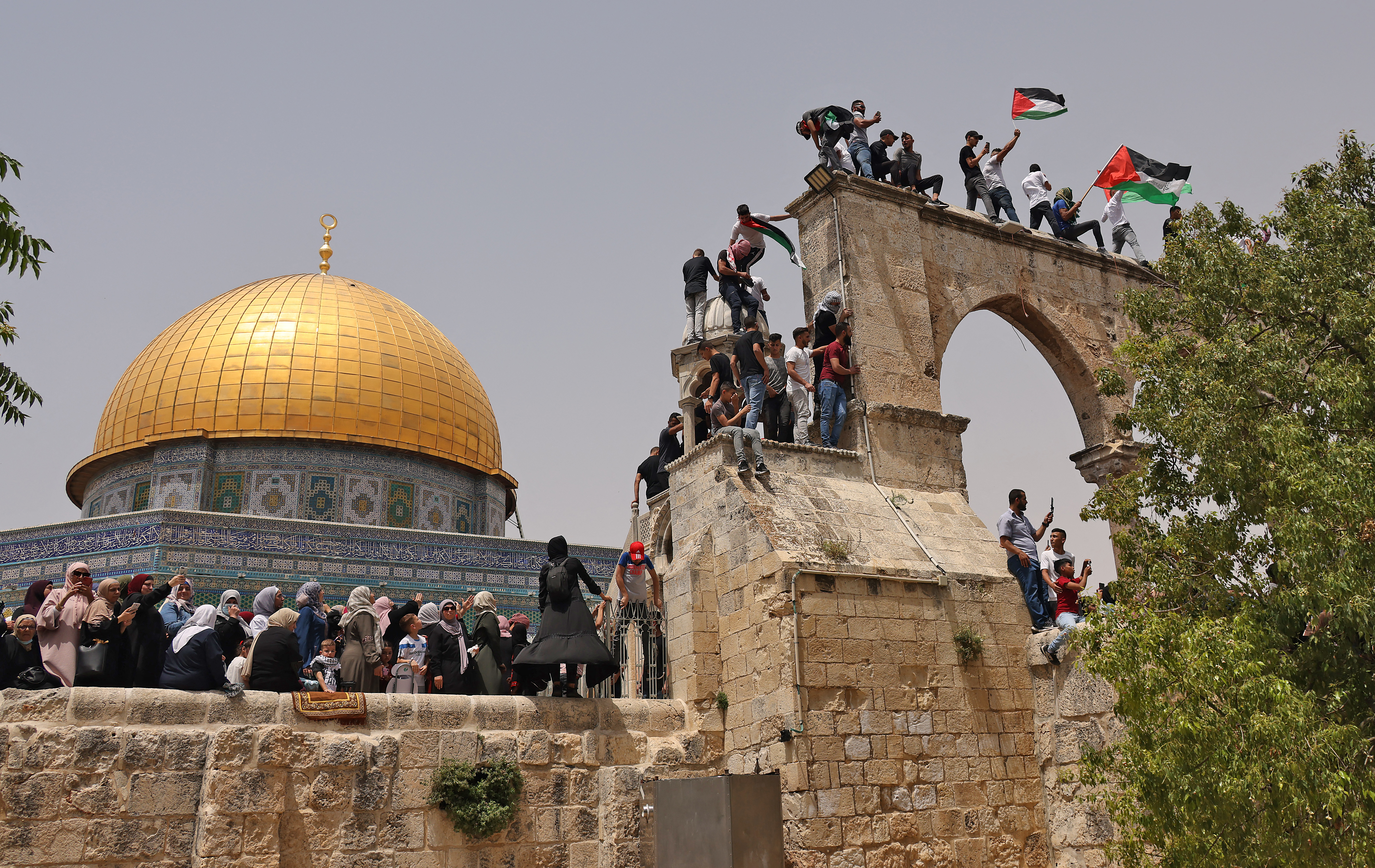 Palestinians gather in occupied East Jerusalem's Al-Aqsa Mosque compound [Ahmad Gharabli/AFP]