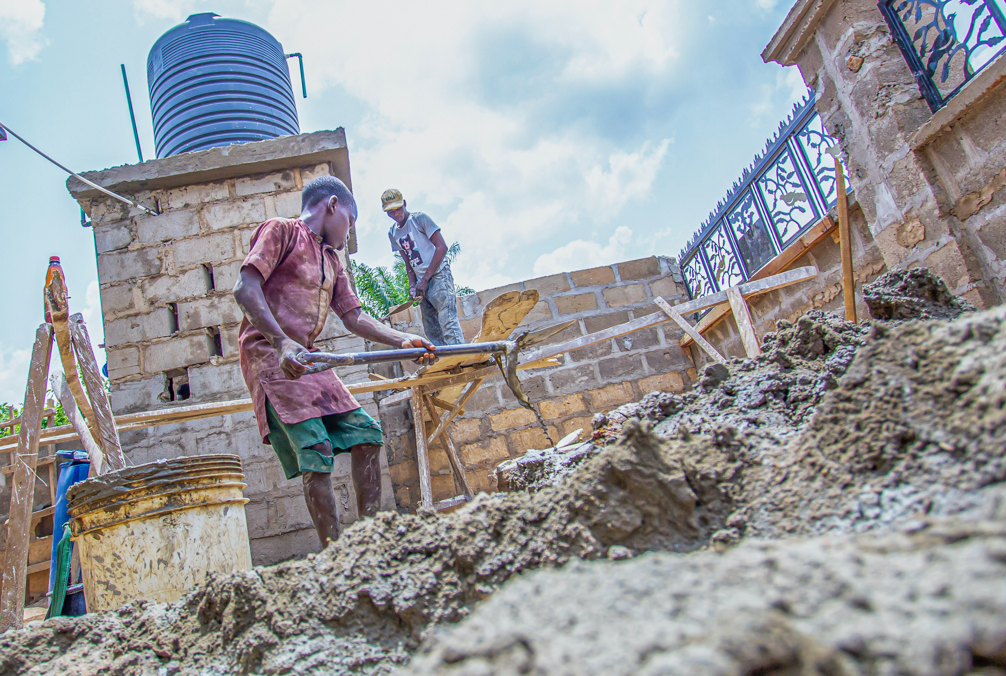 “People are shocked sometimes when they compare my physical size to the amount of work that I do.” Kunle*, 13, apprentice bricklayer [Femi Amogunla/Al Jazeera]