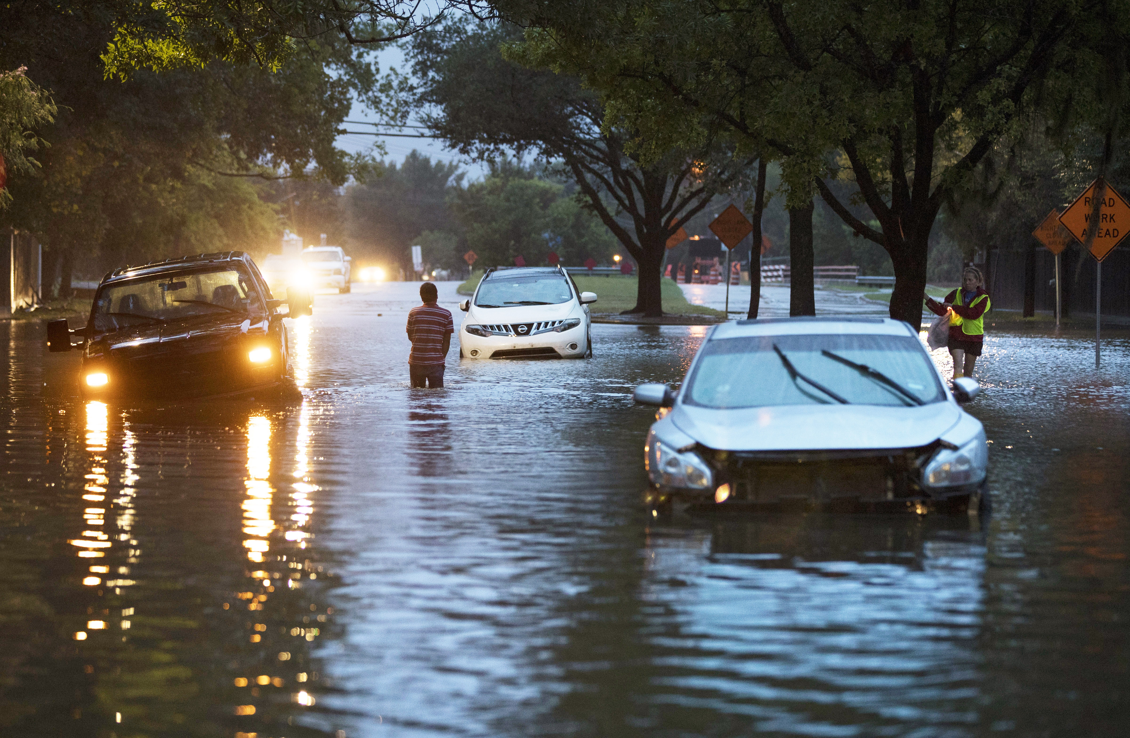 Stranded vehicles sit where they got stuck in high water from Hurricane Harvey on Dairy Ashford Drive, August 28, 2017 in Houston, Texas. In response to the devastation it experienced from Hurricane Harvey, the city, under Mayor Sylvester Turner’s leadership, launched the Resilient Houston Strategy, which works to protect people in at-risk neighbourhoods and provide choices for residents who live in floodways [Erich Schlegel/Getty Images]