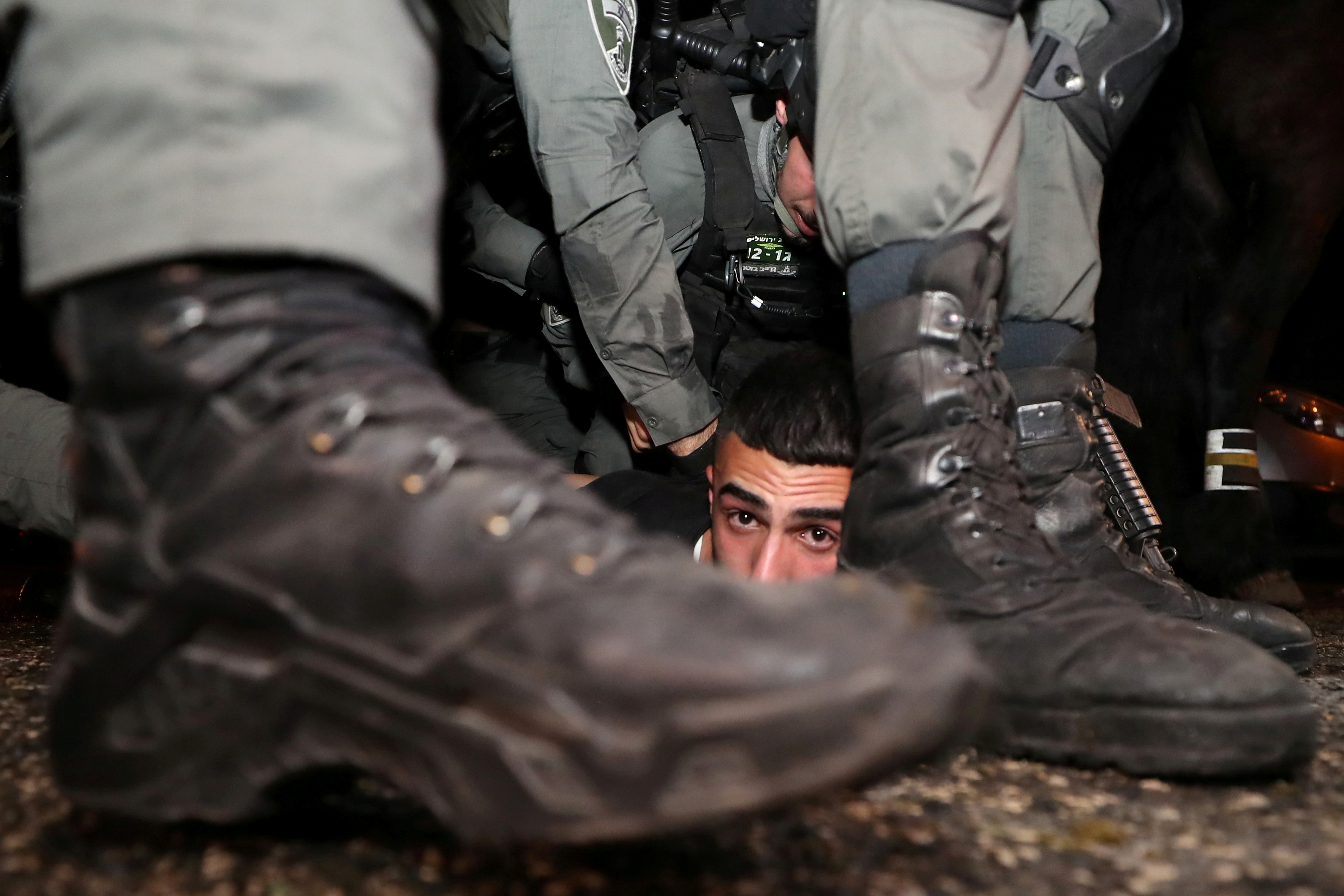 Israeli police detain a Palestinian protester amid ongoing tension ahead of an upcoming court hearing on the forced displacement of Palestinian families from their homes in the Sheikh Jarrah neighbourhood of occupied East Jerusalem May 5, 2021 [Reuters/Ammar Awad]