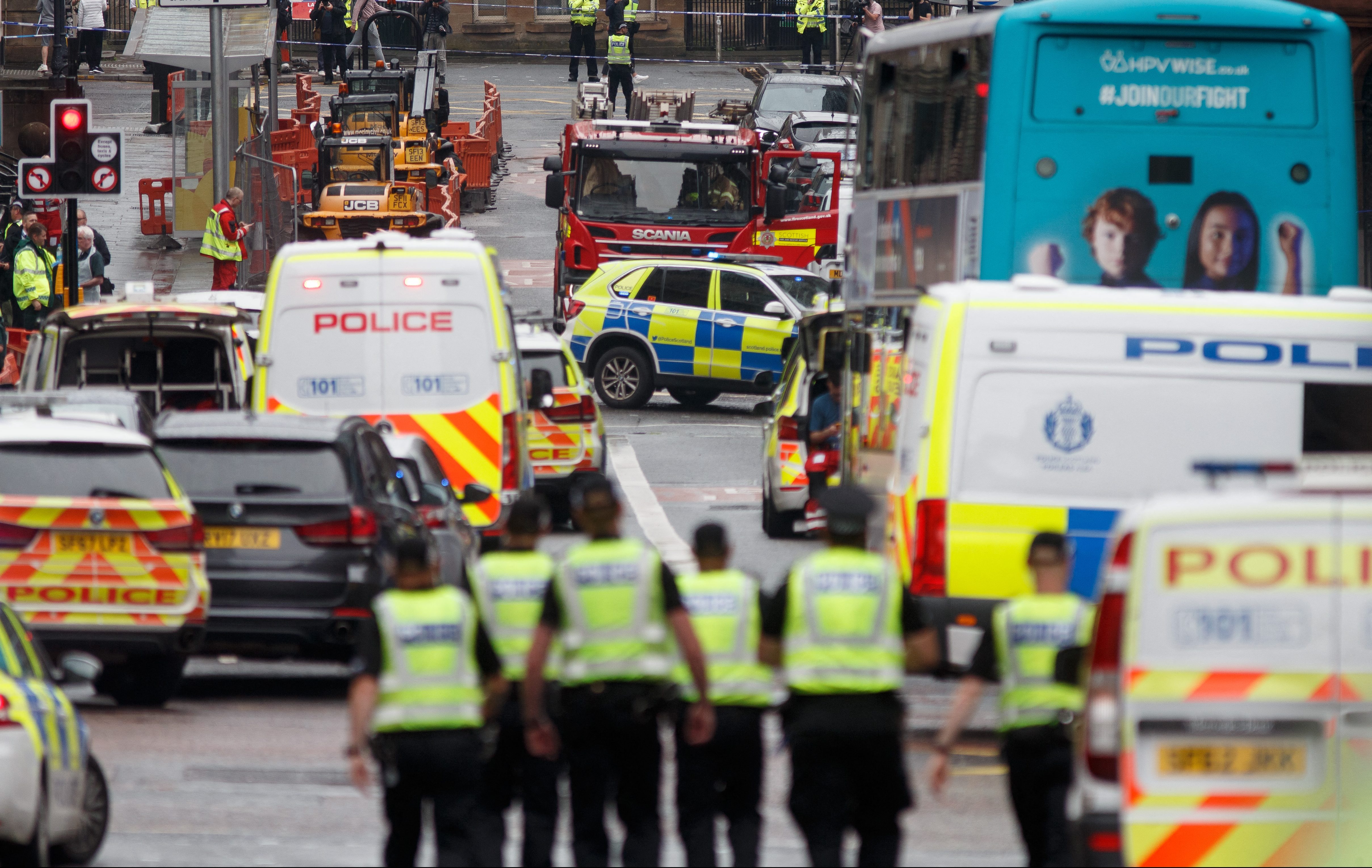 Police and emergency services respond at the scene of a fatal stabbing incident at the Park Inn Hotel in central Glasgow on June 26, 2020 [File: Robert Perry/AFP]