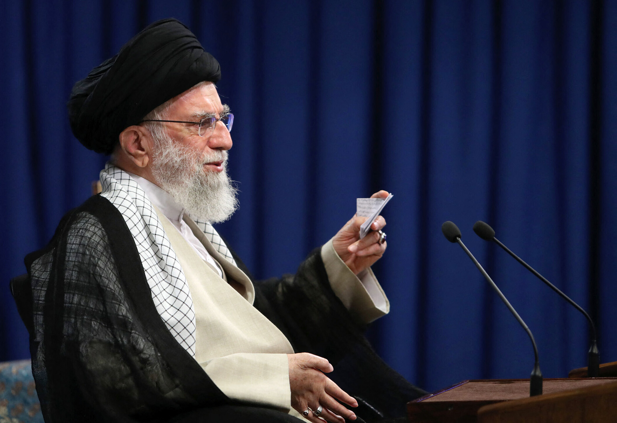 This handout picture provided by the office of Iran's Supreme Leader Ayatollah Ali Khamenei on June 4, 2021 shows him addressing the nation during a live TV appearance. In his speech, Khamenei urged voters to turn out for this month's presidential election, warning that staying away would mean doing the work of the "enemies of Islam". Iranians are set to elect a successor to President Hassan Rouhani on June 18 [Khamenei.IR/ via AFP]