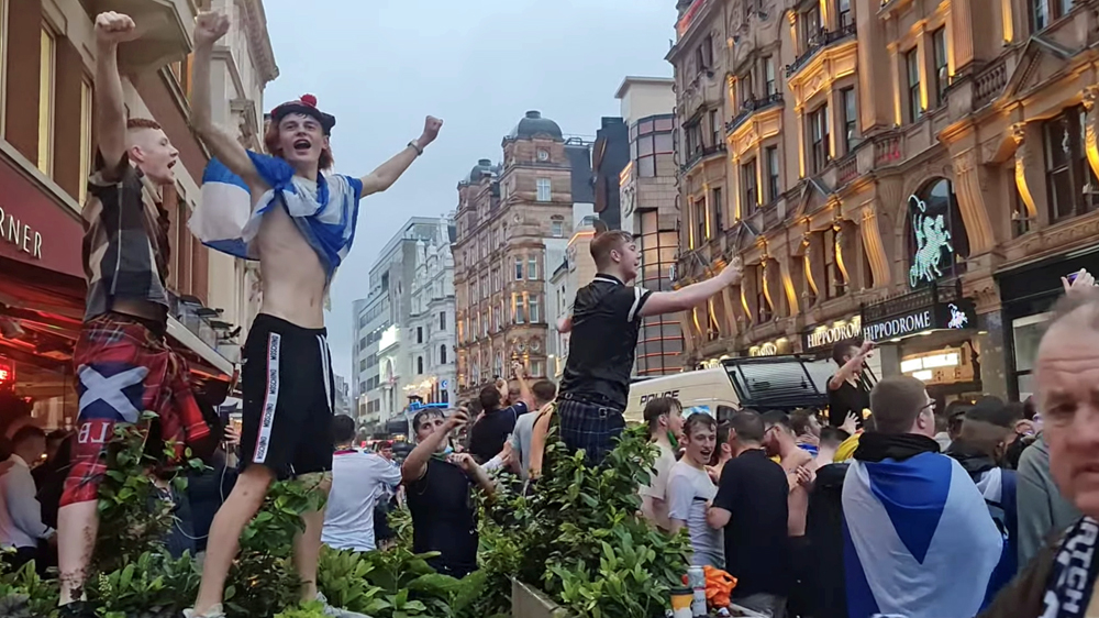Scottish fans gather at Leicester Square ahead of the Euro 2020 Group D match between England and Scotland, in London, Britain June 17, 2021 in this still image obtained from a social media video.