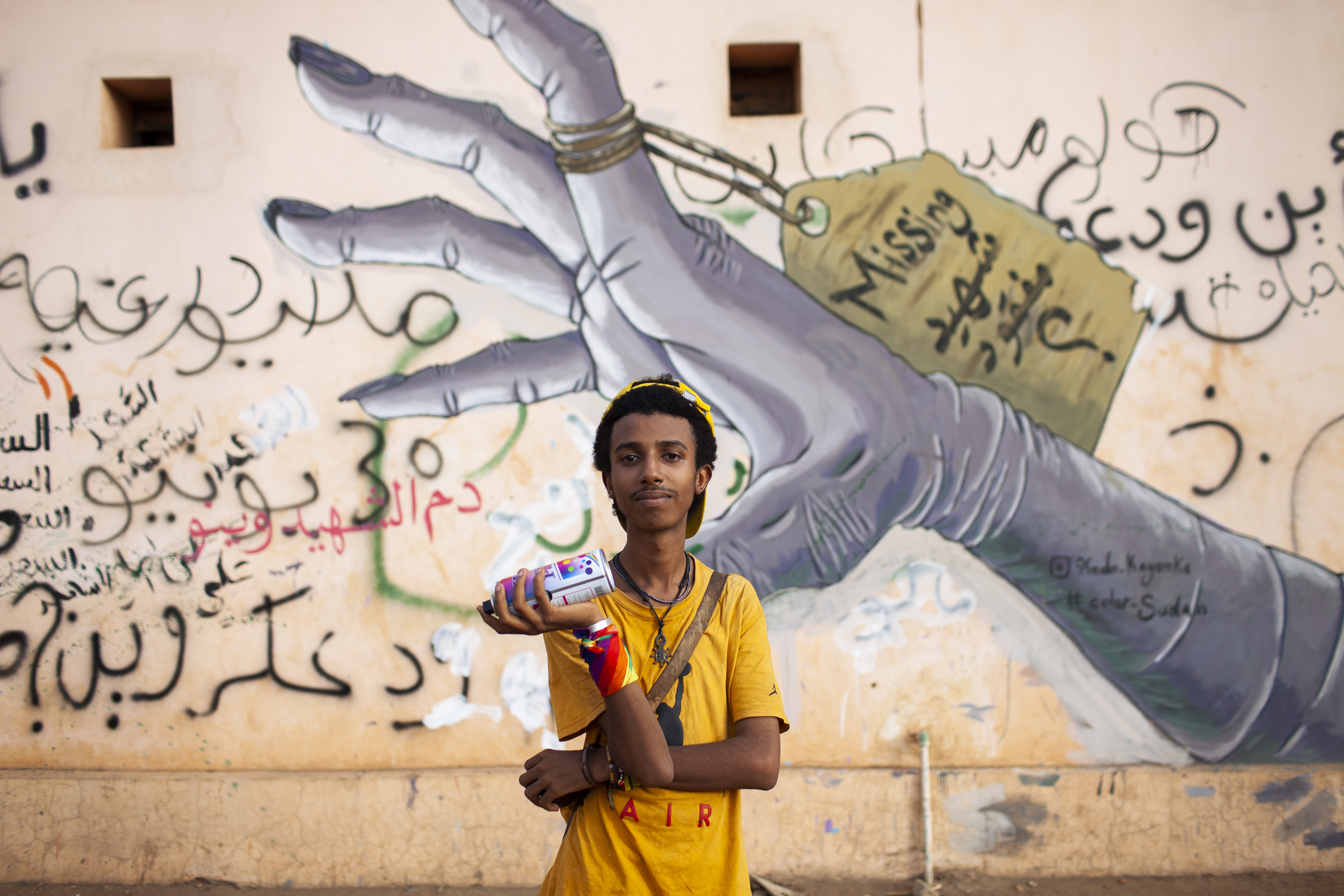 Medo Kagonka is a graffiti artist who became known for his provocative murals during the 2019 revolution, including this one on the wall of the city's morgue [Matteo Lonardi/Al Jazeera]