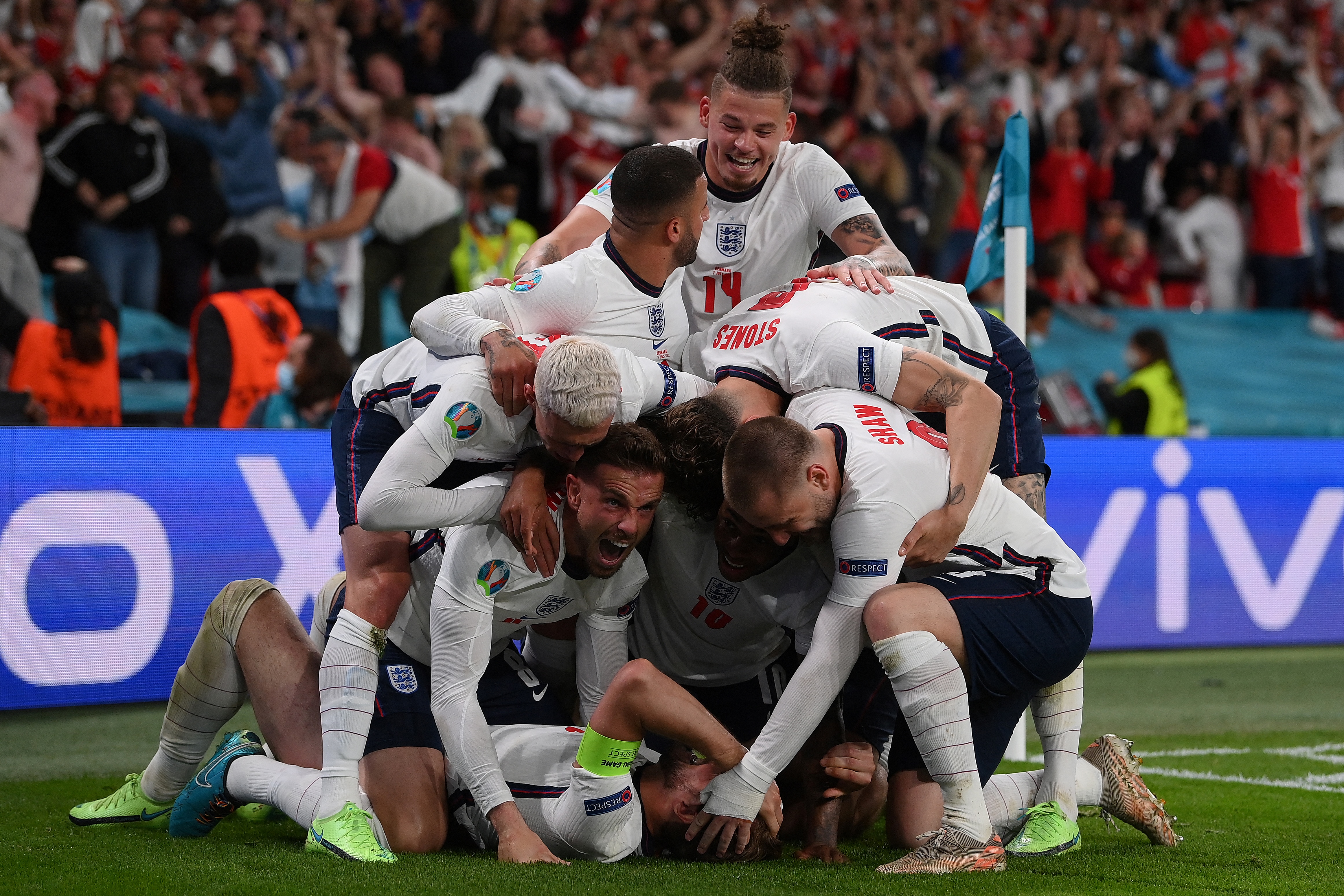 England players celebrate the goal by England's forward Harry Kane [AFP]