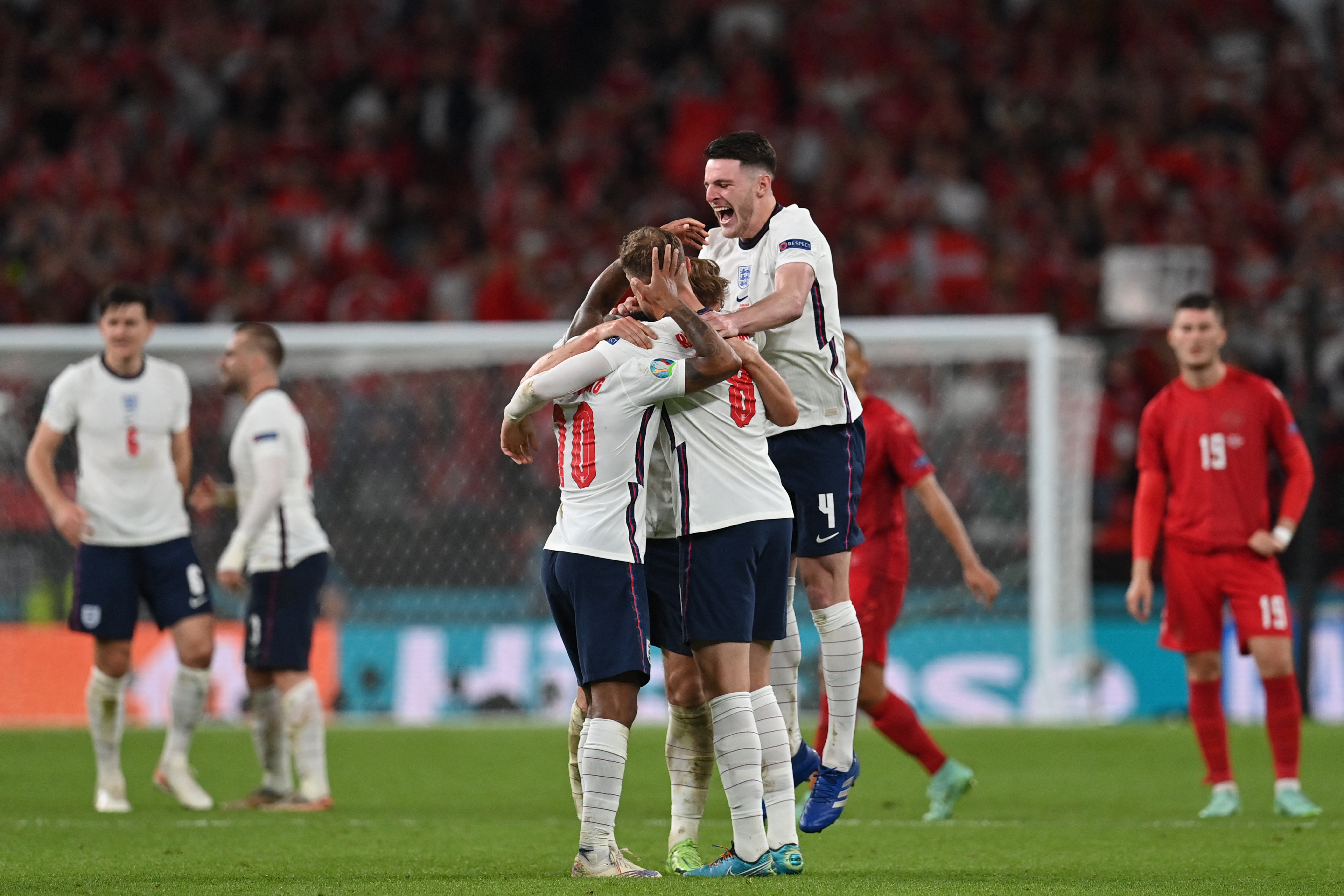 England's players celebrate after winning the UEFA EURO 2020 semi-final [Paul ELLIS/ Pool via AFP]